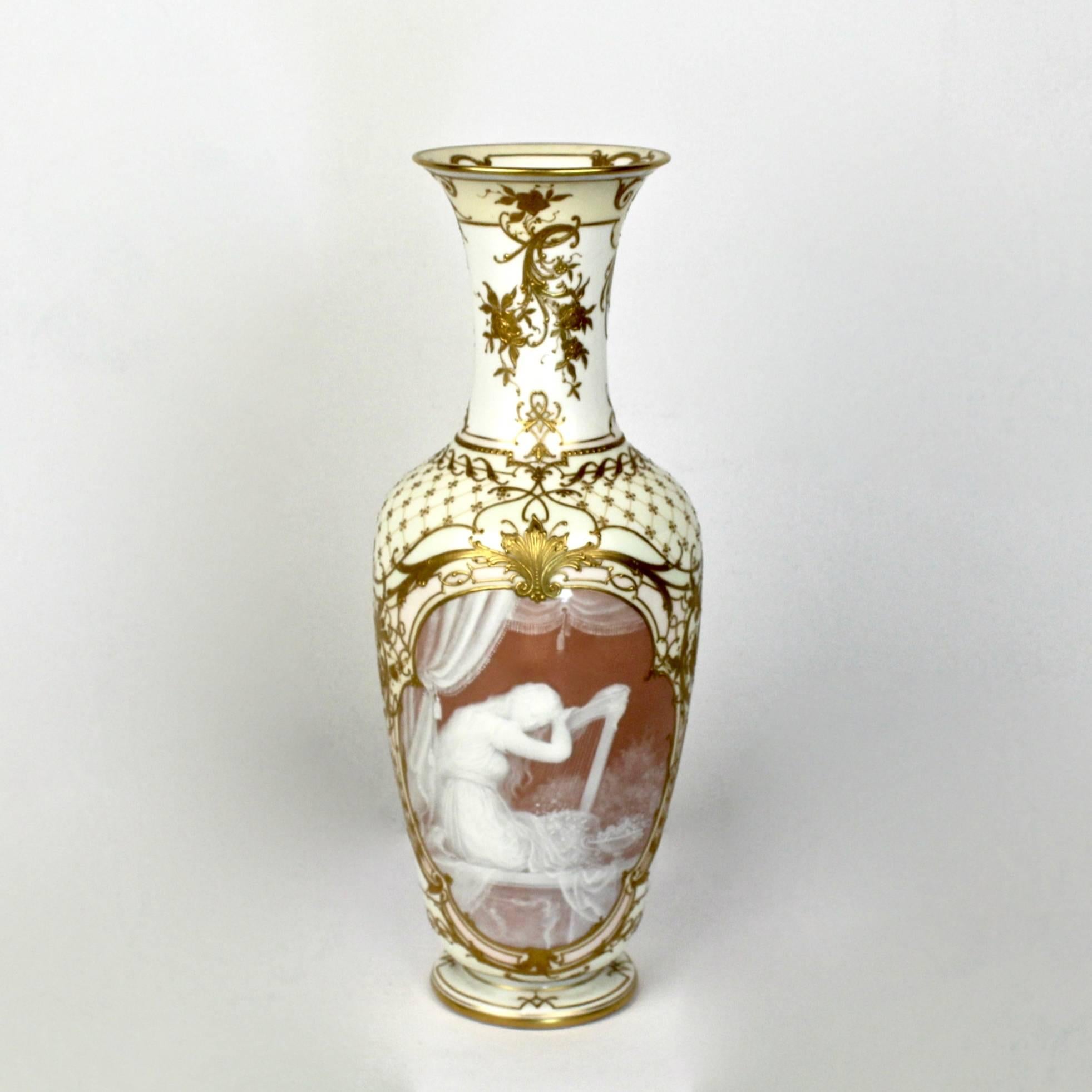 A Köngliche Porzellan Manufaktur (K.P.M.) pâte-sur-pâte porcelain vase of the finest quality. 

The front depicts a young beauty seated at a harp in a large cartouche. The reverse has hand painted flowers. The vase has raised gold decoration