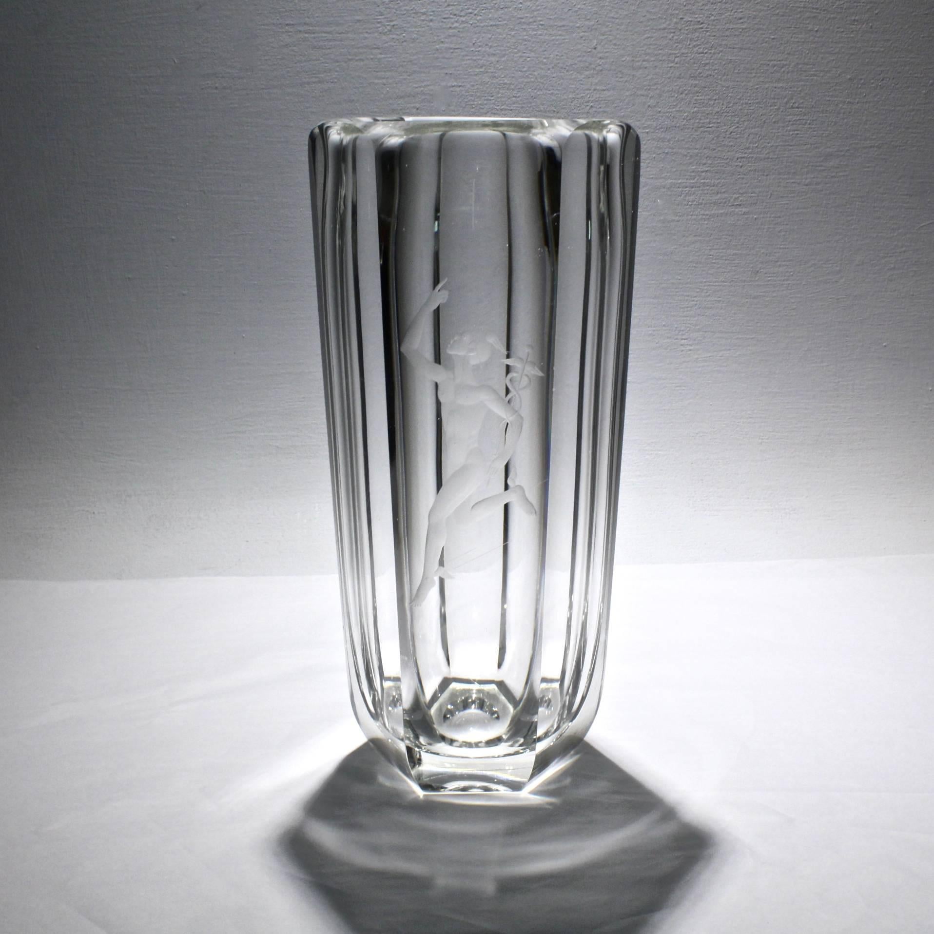 A fantastic, large, faceted Art Deco vase by Elis Bergh for Kosta Boda with an engraved image of the Greek god Mercury in full stride on the front. 

The base has an etched mark for Kosta Boda and Elis Bergh. 

Measures: Height circa 13 1/4 in.