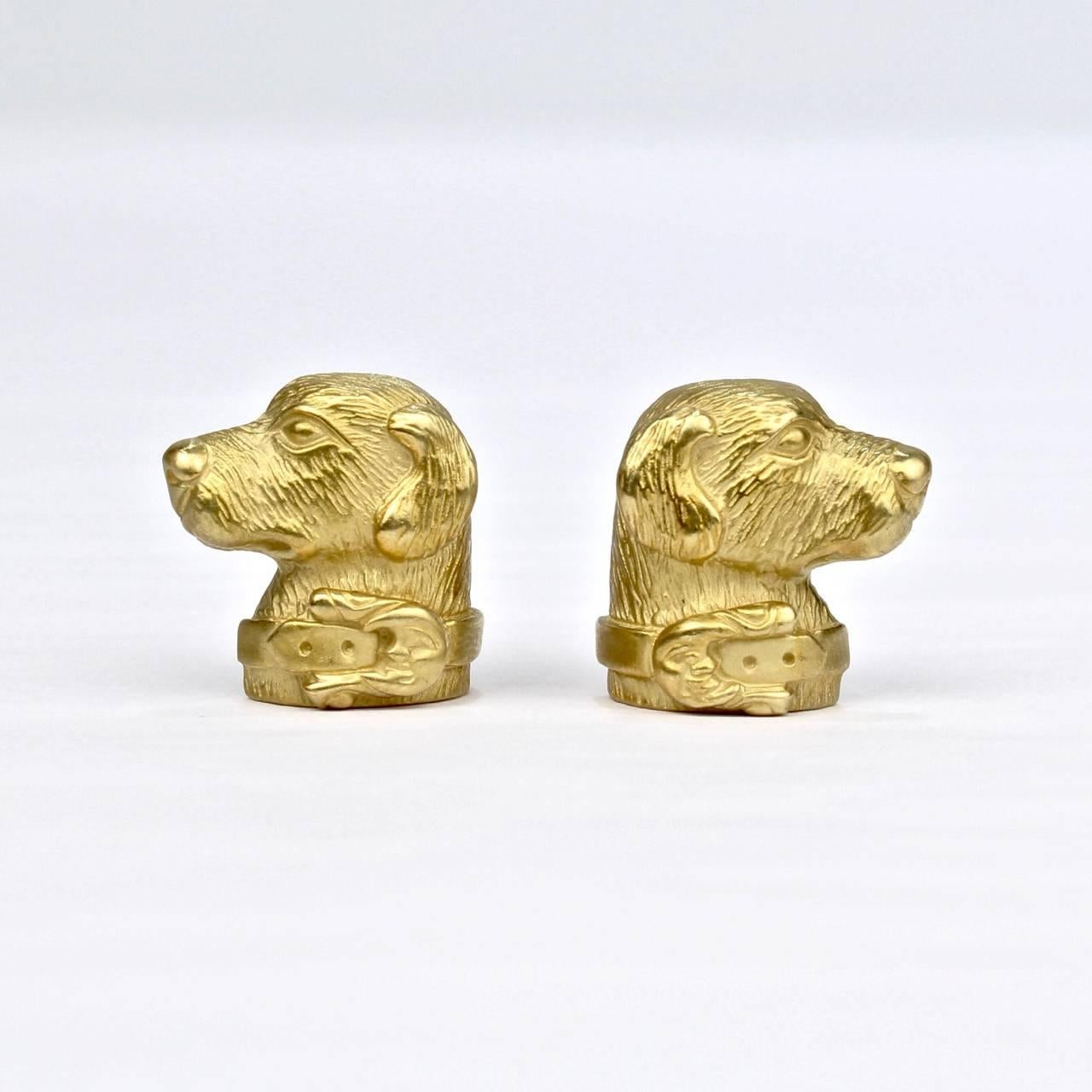 A fine and heavy pair of jewelry designer Barry Kieselstein-Cord's labrador retriever earrings. 

The complimentary pair depicts a well-defined dog's head in profile. Each dog wears a collar.

This earrings have omega clip backs.

Reverse is