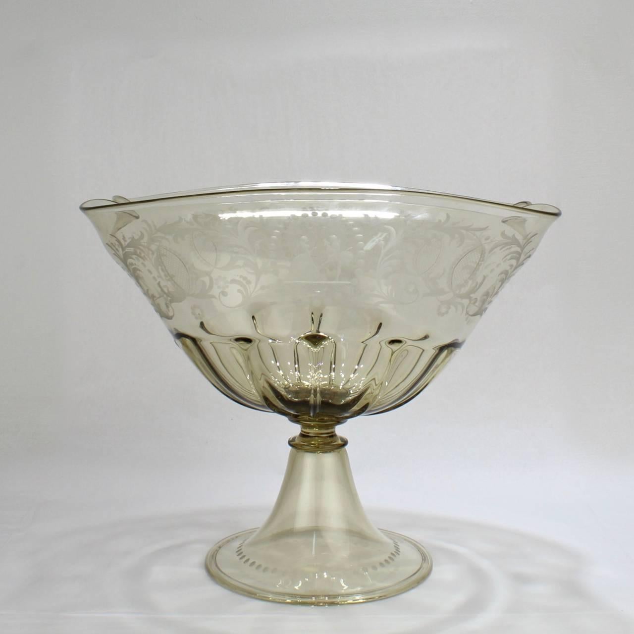 A good vintage Pauly and Co. Venetian glass footed bowl.

Well-scaled as a table centerpiece for fruit or flowers.

Manufactured by Pauly and Co. in Venice, Italy in a light amber blown glass with a broad rim with Renaissance style etching