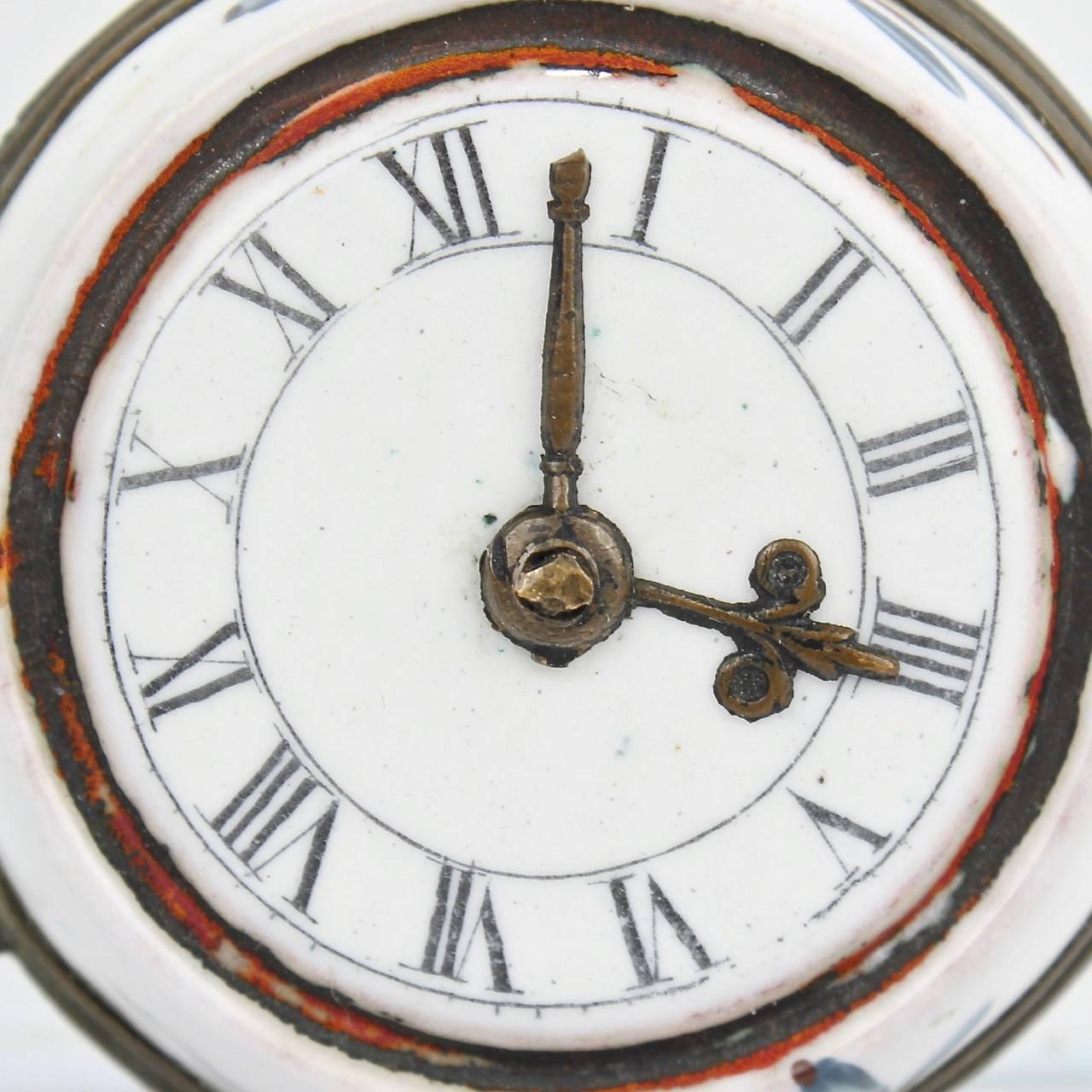A rare 18th century English Battersea or South Staffordshire enamel patch or snuff box in the form of a pocket watch. 

Interior retains an old Manheim retailer's sticker.

Measures: Diameter ca. 1 5/8 in.


