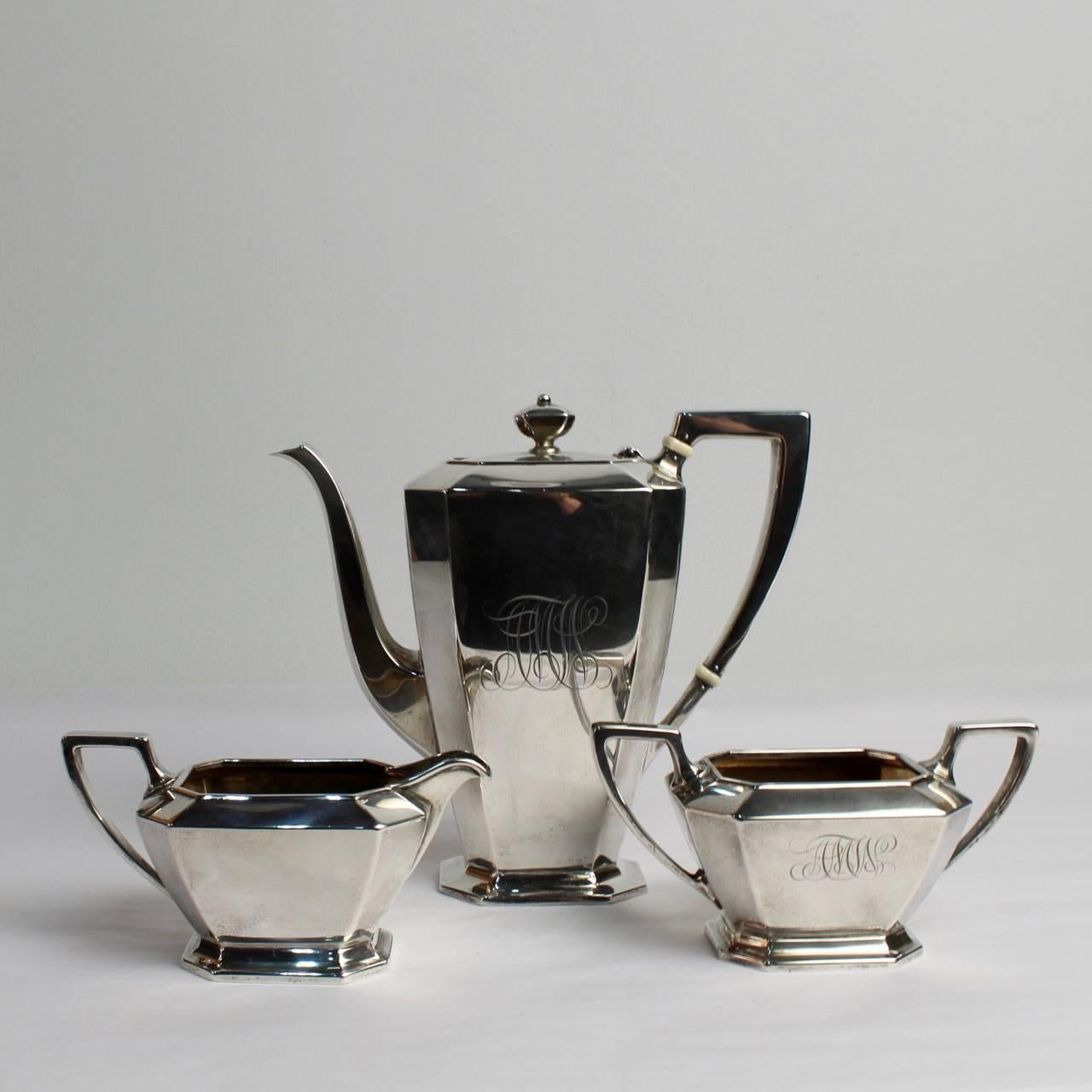 An antique Gorham Fairfax pattern sterling silver tea set consisting of a teapot, a creamer and a sugar bowl. 

Bases are marked for Gorham, sterling silver, and with the Fairfax pattern name.
  
Measurements:
Teapot height ca. 7 1/2 in.