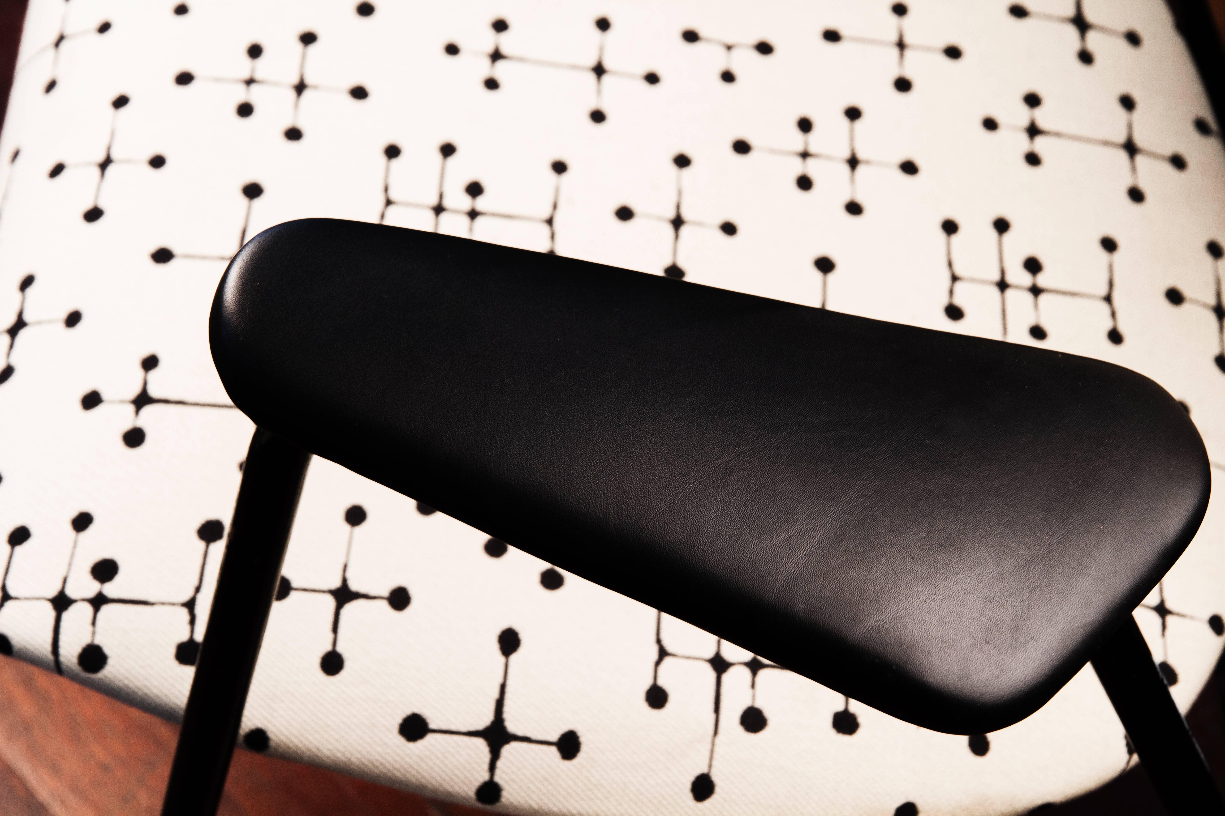 Pair of armchairs designed by Willy Van Der Meeren. It's an special edition for the inaguration of the Atomium in Brussels in 1958. The upholstery is a special design by Ray Eames only for these armchairs.