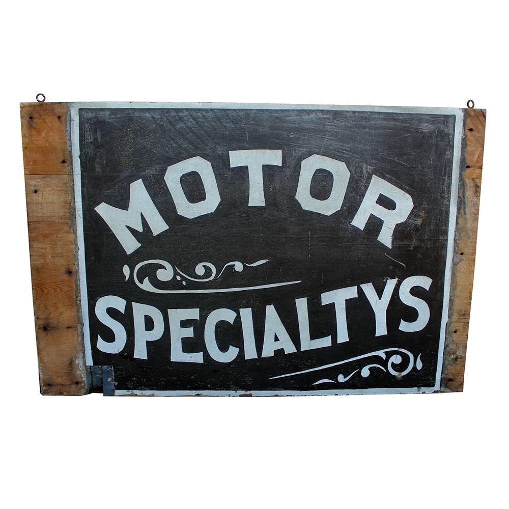 An excellent example of early 20th century advertising. This sign, circa 1910 was hand-painted in reflective sand paint on wood board with stylized text and decorative flourishes.