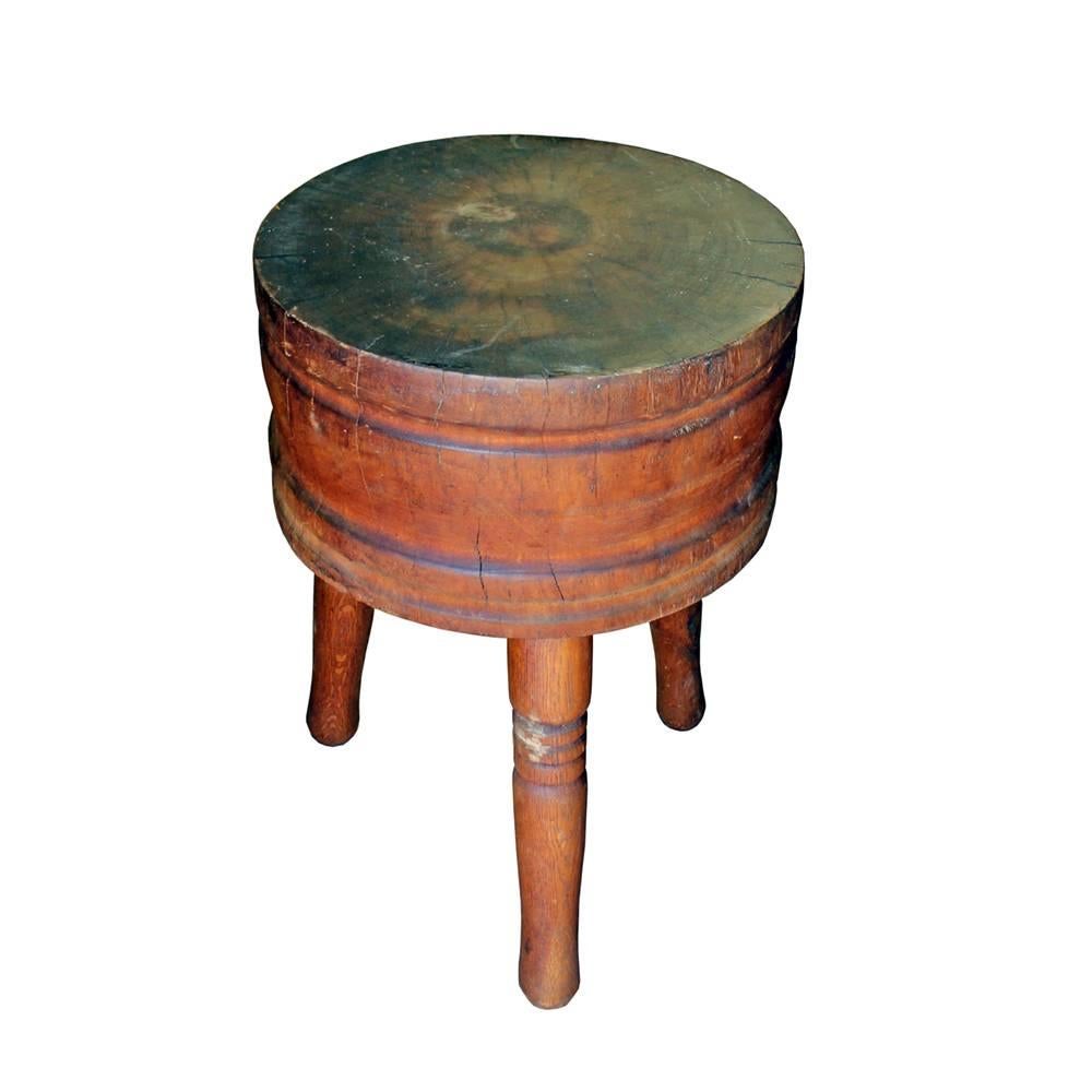 A beautifully handmade late 19th century tripod butcher block. The three legs have been given delicate turning and the extra thick solid maple round has some matched ribbing to compliment the design of the legs. An exceptionally unique piece