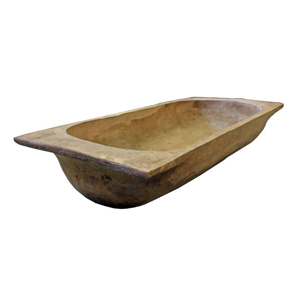 Beautiful patina and wear abound on this early 20th century French dough trough. With a size to match its amazing character, this 64.5” trough would make an excellent home or retail accent.