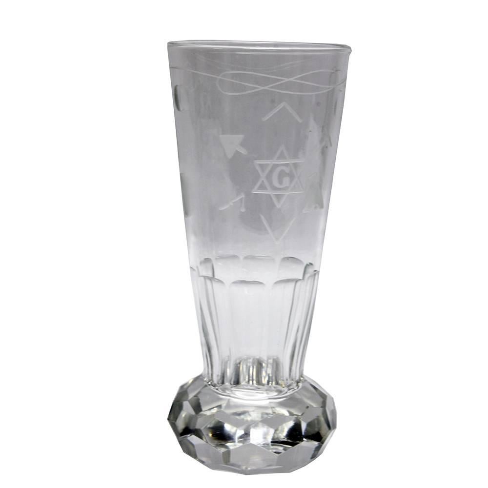 Made of heavy weighted crystal, this set of faceted bottomed beakers is truly special. The conical shaped glasses have three different sizes and were most likely used as a part of a masonic ceremonial ritual. Each glass is decorated with various