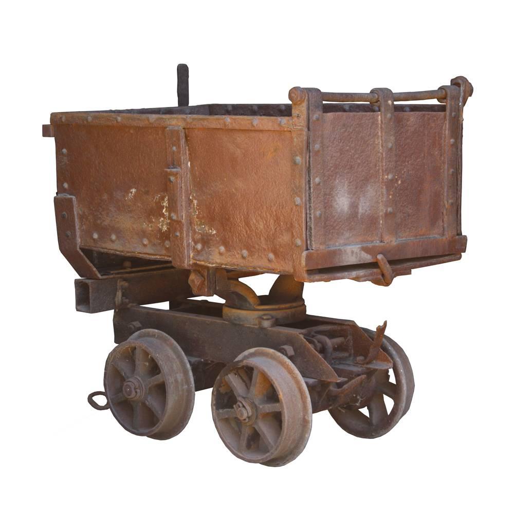 This absolutely amazing 19th century iron ore cart is one of the coolest pieces we’ve had here in the shop in quite a while. Composed of solid cast iron, the rustic casting of the sides and braces, which are all hand riveted, is just fantastic.