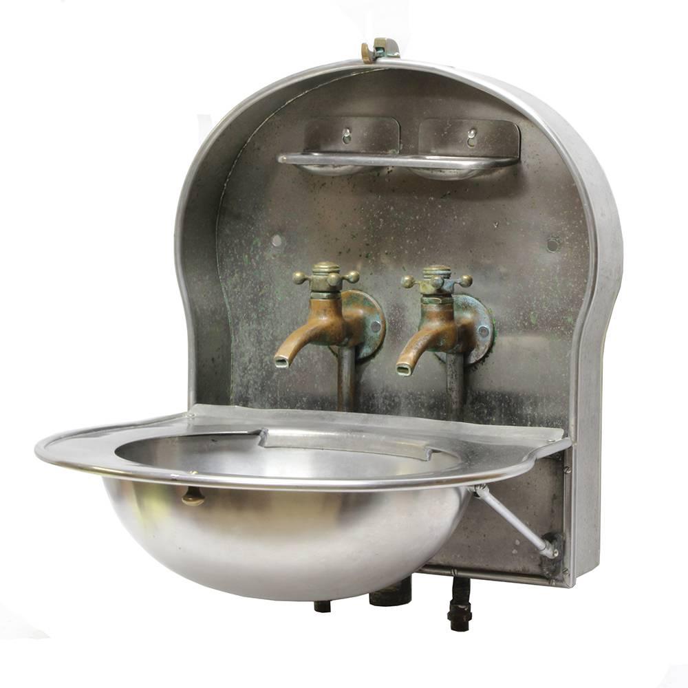 The Pullman Company was well-known throughout the late 19th and early 20th century as a manufacturer of luxury railcars, catering to commercial lines as well as individuals with substantial private wealth. This stainless steel Pullman fold out sink
