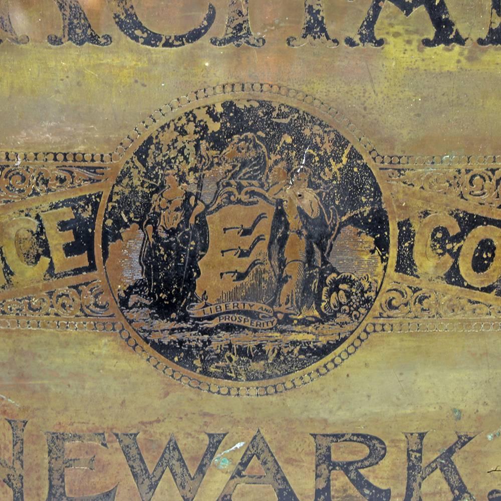 The Merchants Insurance Company of Newark, New Jersey was incorporated in 1858. We don’t have much information, other than knowing that their original headquarters building was demolished sometime in the 20th century. This beautifully worked brass