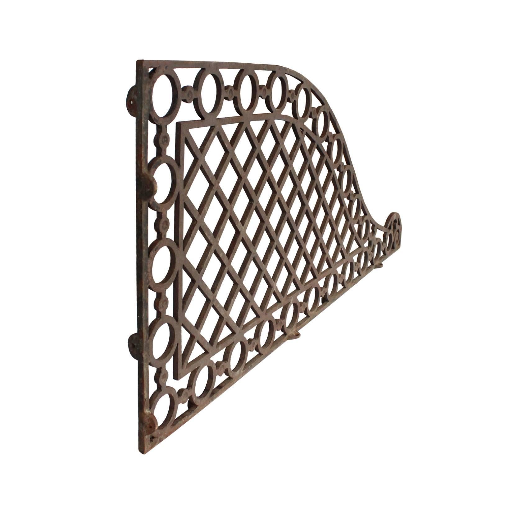 Salvaged from a firehouse in New England, these cast iron stall dividers would have graced a well dressed stable. Their primary function was to create a barrier between stalls whilst allowing light and air to flow through, though they also provide