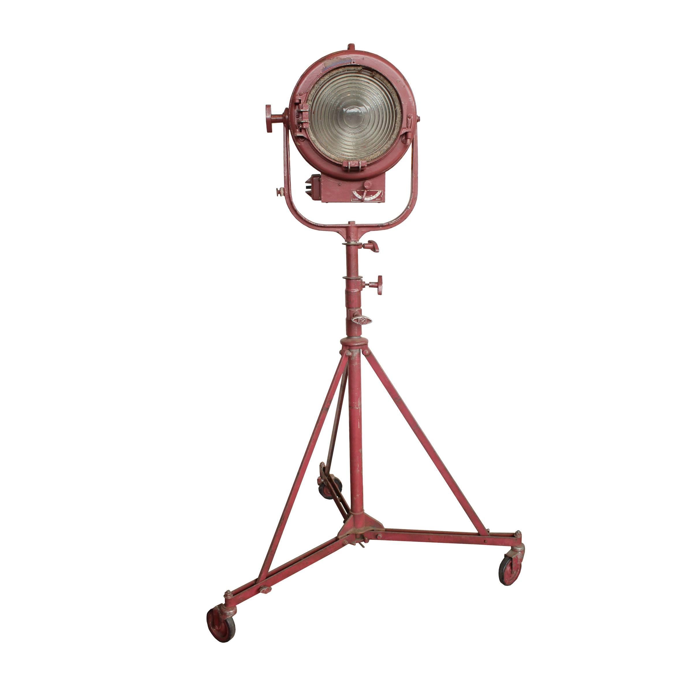 Manufactured in Hollywood, CA, in the late 1940s, these type 410 Solarspot movie spotlights stand on rolling tripods. There is a slight variation between the two lights in their manufacturer's marking and handles. Compatible with 1000 W bi-post