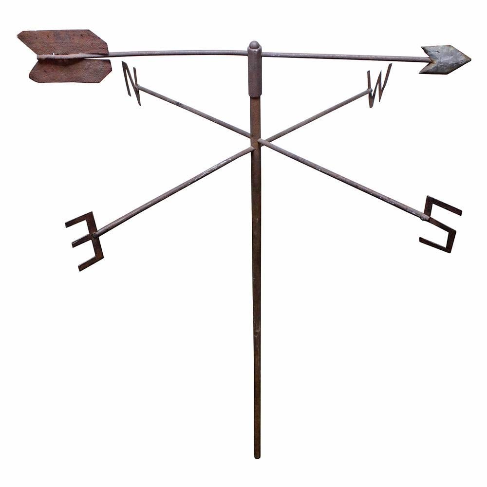 Featuring hand-cut cardinal directions and a hand-hammered arrow, this rusted iron weather vane is an exemplary piece of American Folk Art. Arrow is removable.
