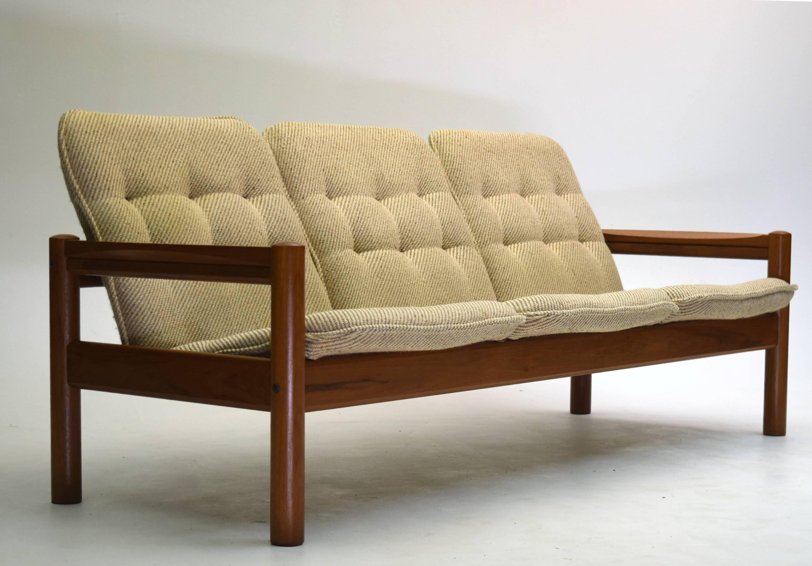 Made in Denmark by Domino Mobler in all-teak timber. The lumber used is thick and quality solid teak especially the front and back frames all carved with curves.

Sofa measures 72" wide, 30" tall and deep, with seat height about 15"