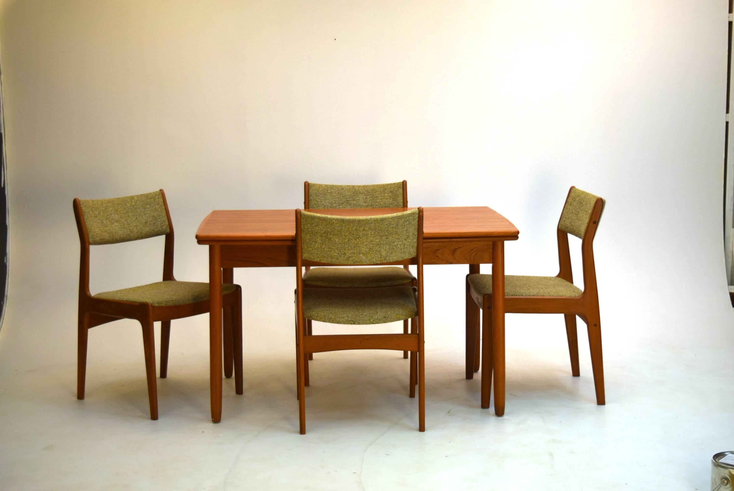 Produced between 1960-1970, this model by Scandinavia woodworks features superior teak over models of the period and while seats six with six side chairs provided, an additional captains armchair is provided so you have an extra chair - 7 in