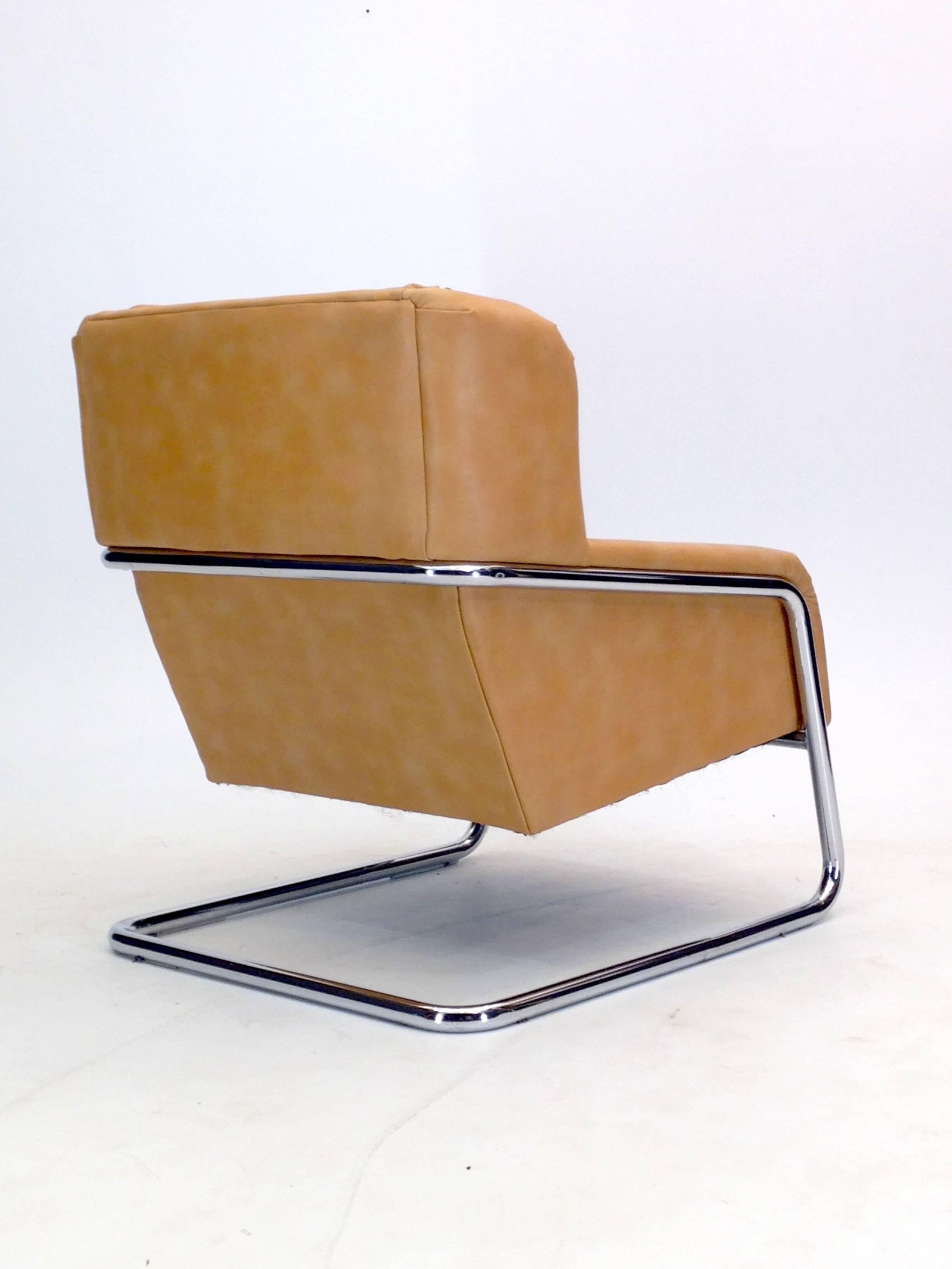 With distinctive architectural lines and a modernist profile, this large armchair is designed for comfort and follows the low profile of modern architectural lines. It is a heavy construction with a tubular steel frame that is one entire piece and