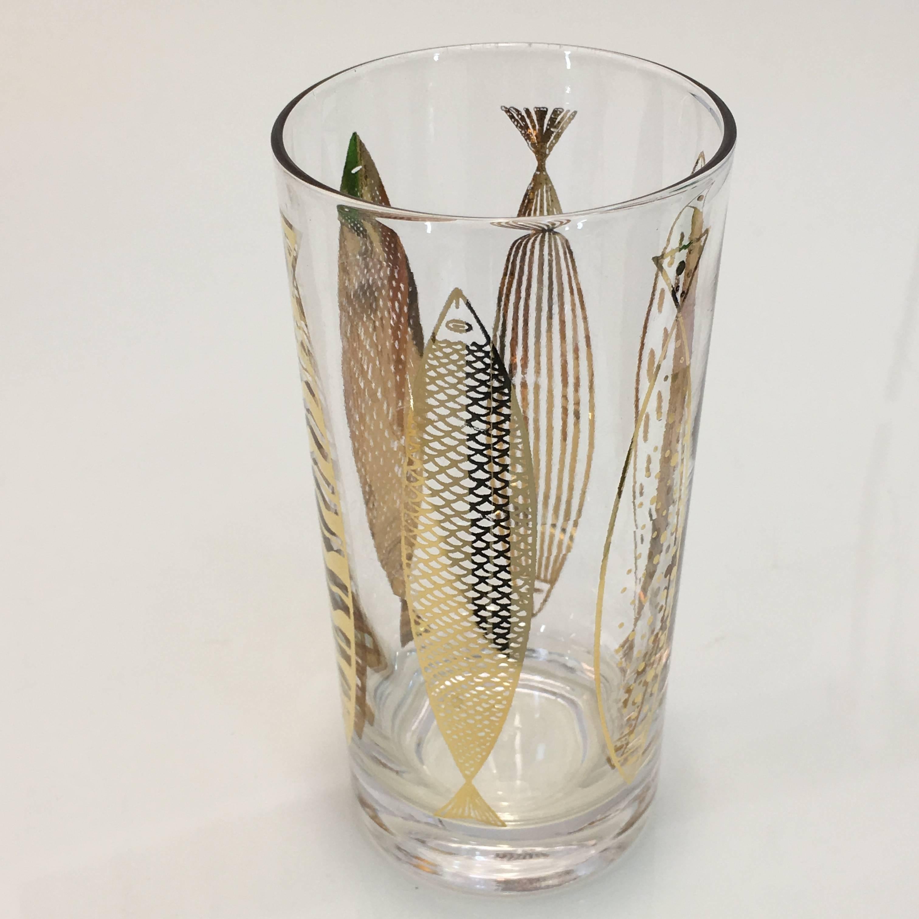 True Mid-Century Modern barware set of eight glasses by Fred Press and signed to each glass. Features gold impressed abstract fish motif to the glasses. They are in excellent condition with minimal loss of gold.

Each measures 2.75