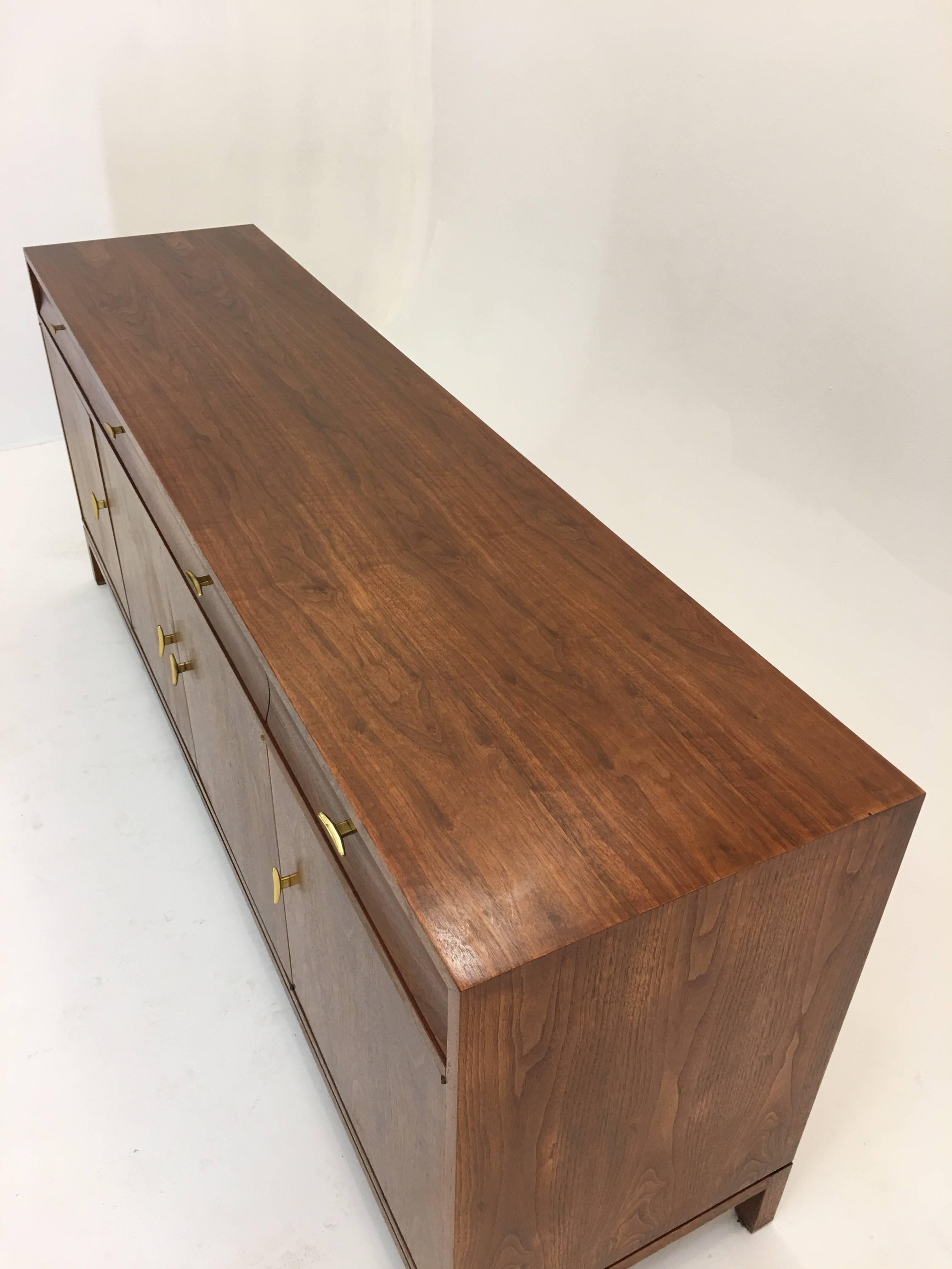 Arguably one of the most impressive designs from the works of Edward Wormley for Dunbar, circa 1955. For use as a credenza or buffet, the dining table and chairs that accompanied this piece is also listed.

Construction of the piece is second to