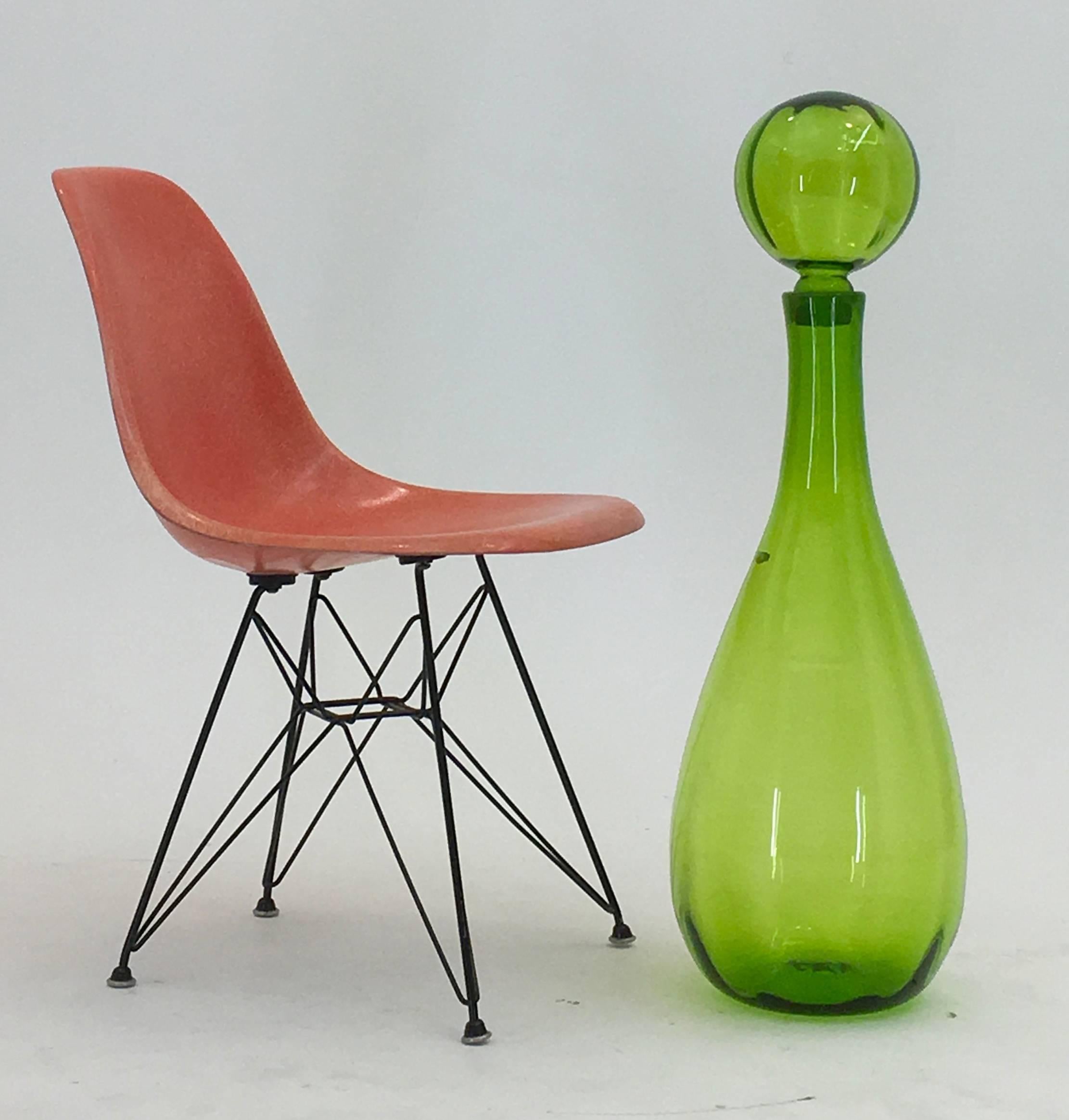 1970
John Nickerson
Blenko, USA
Model 7054

Created by American John Nickerson in 1970 for Blenko, this monumental sized floor decanter model 7054 was produced in limited numbers with a subtle optical effect added via subtle ribbing through the main