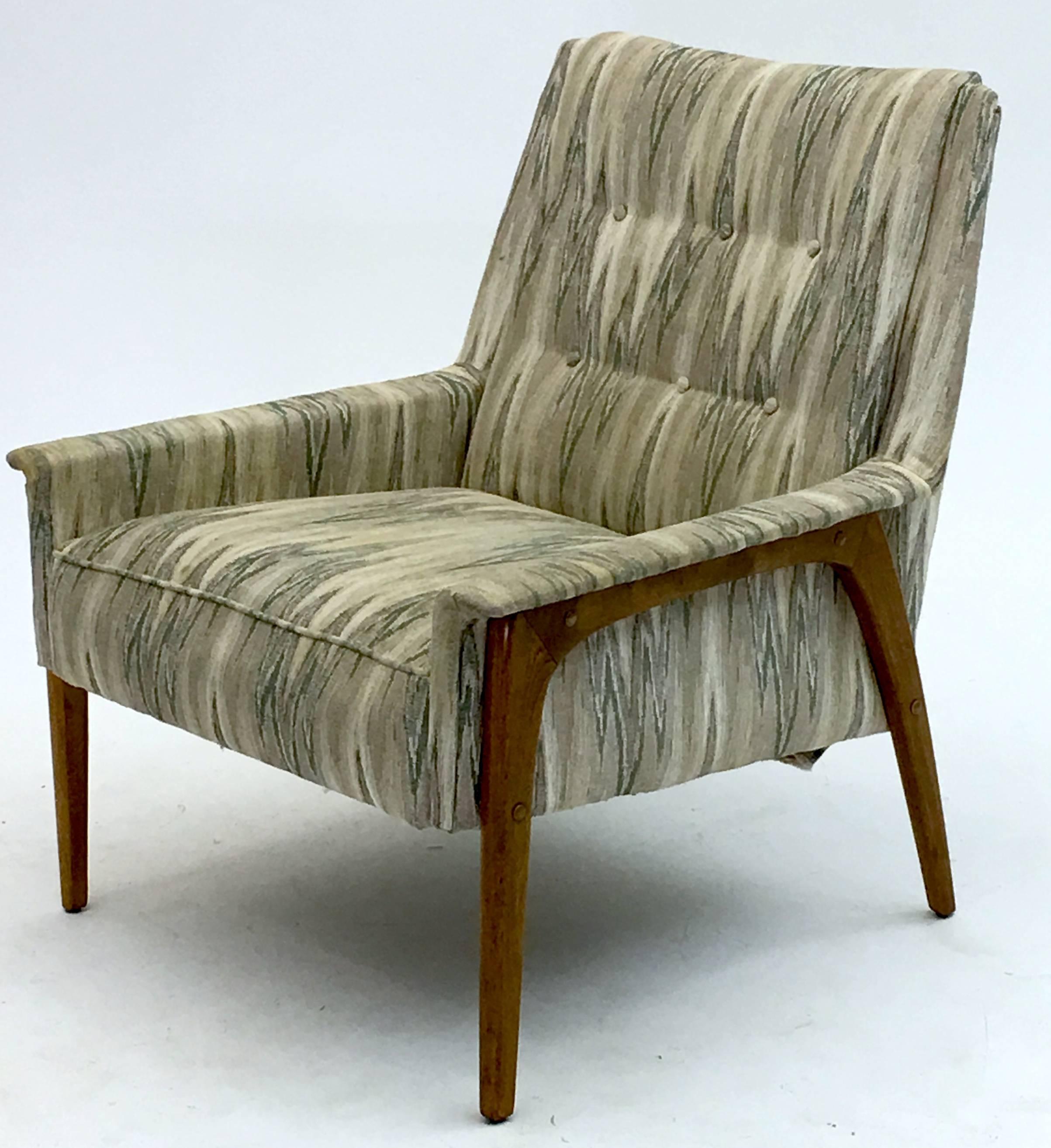 
A true vintage model armchair from the early 1950's, this chair is either produced by Selig in the Danish style or DUX of Sweden. The frames are finished in a walnut type of finish but are actually oak or birch.

It has been reupholstered at least