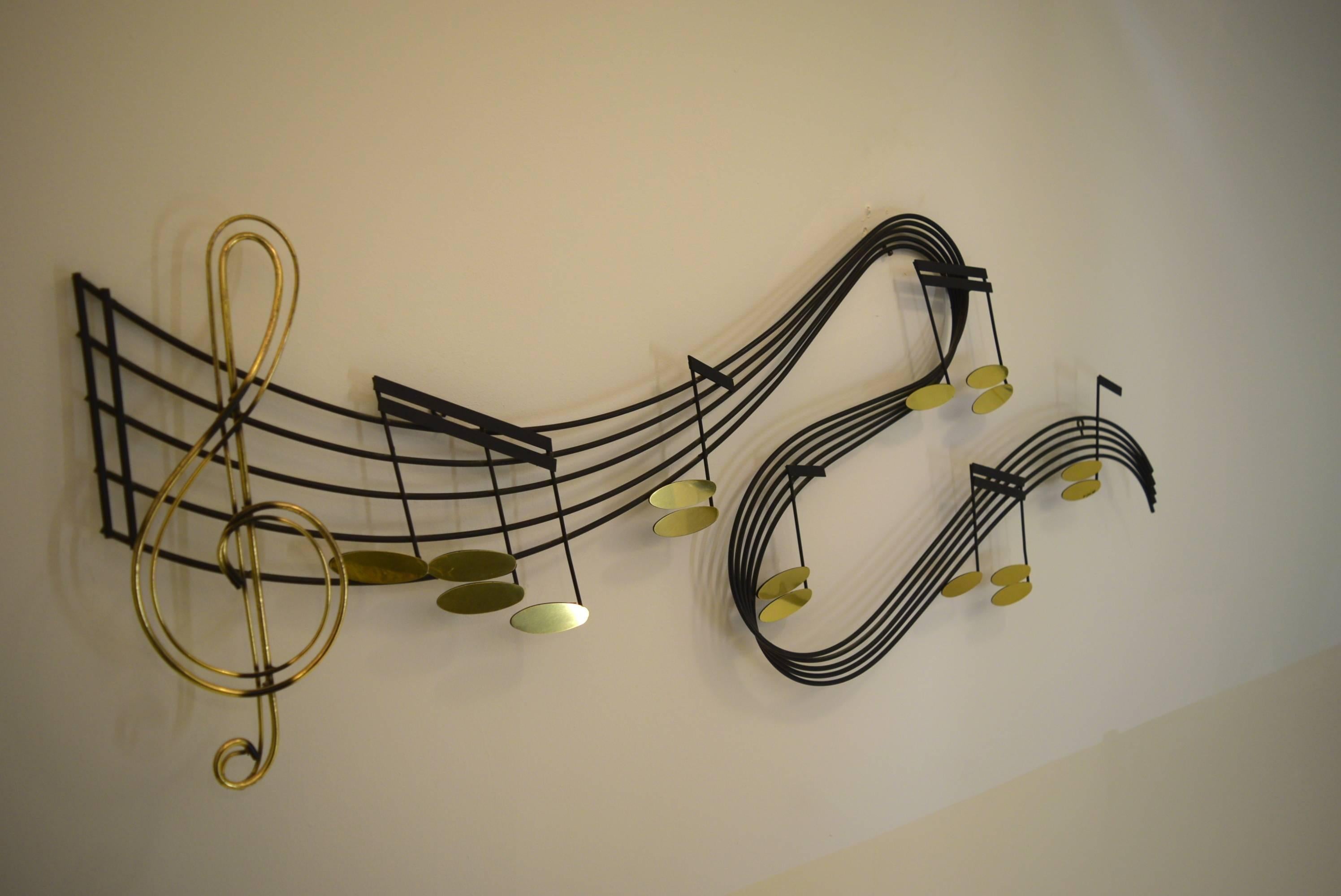 From the artisan studios of Curtis Jere (C. Jere) comes this large wall sculpture featuring a musical sheet note interpretation. This was produced in three sizes, this one being the largest they produced. Ideal for musicians.

Measures 61