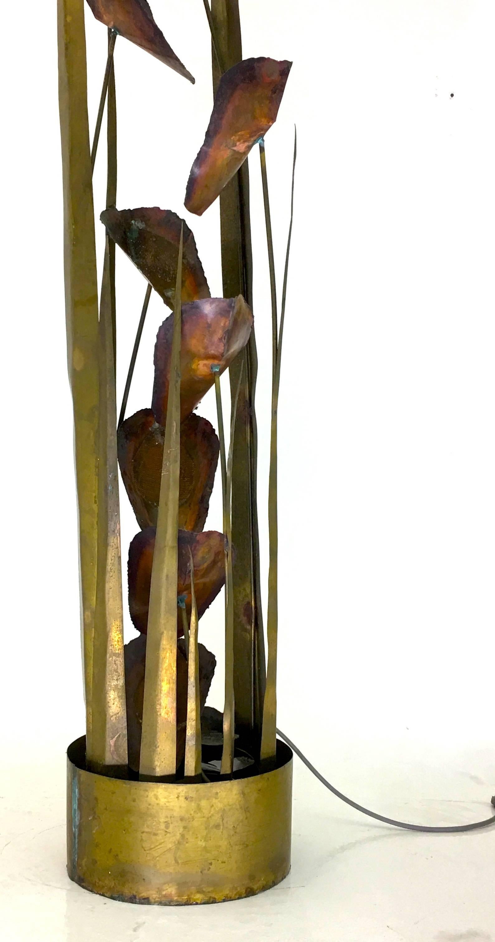 circa 1970
Measures: 72 tall x 14 inches wide.
Silas Seandel


This fully self-contained water fountain by Silas Seandel will be a focal point of any room. Produced circa 1970, a series of cascading water lilies upon stems in copper and carious