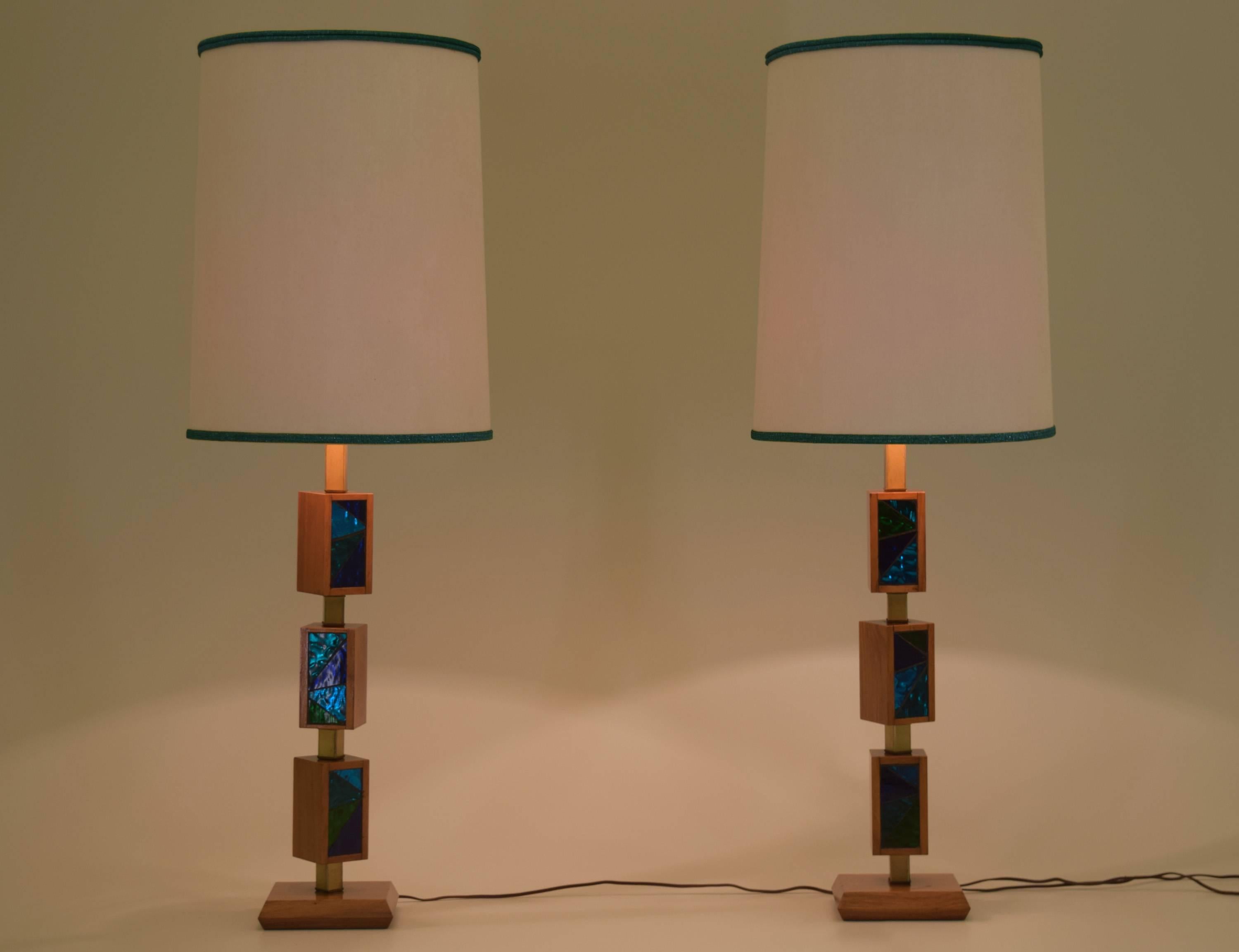 Price is for the pair.

An outstanding pair of lamps designed by Georges Briard with a Danish modern flair. Featuring rotating rectangular boxes with iridescent mosaic glass designs in dynamic blue hues. The boxes can be positioned to suit the