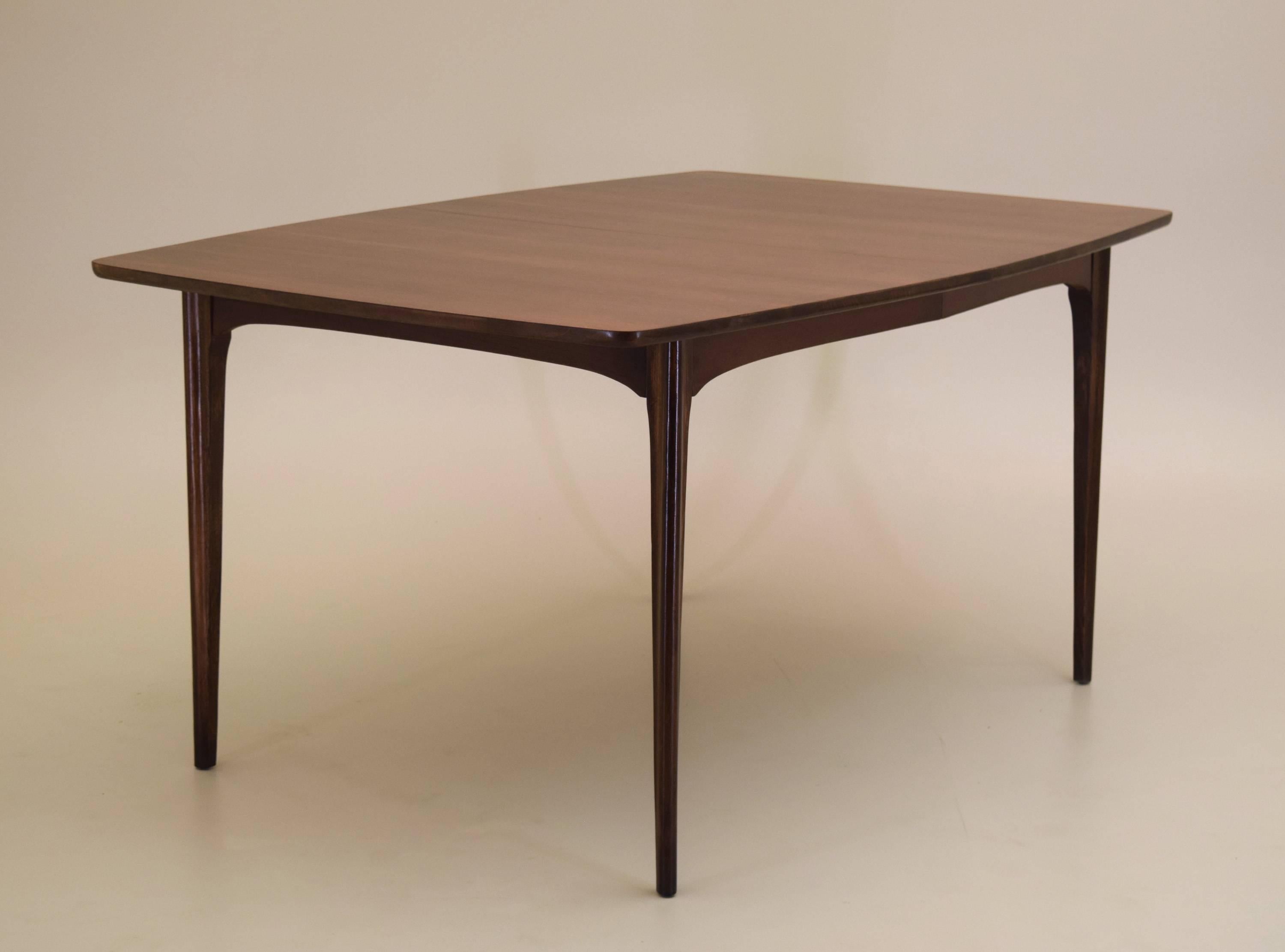 Classic Danish modern style walnut dining table professionally refinished and in beautiful condition produced in American black walnut.

Dining table measures 42