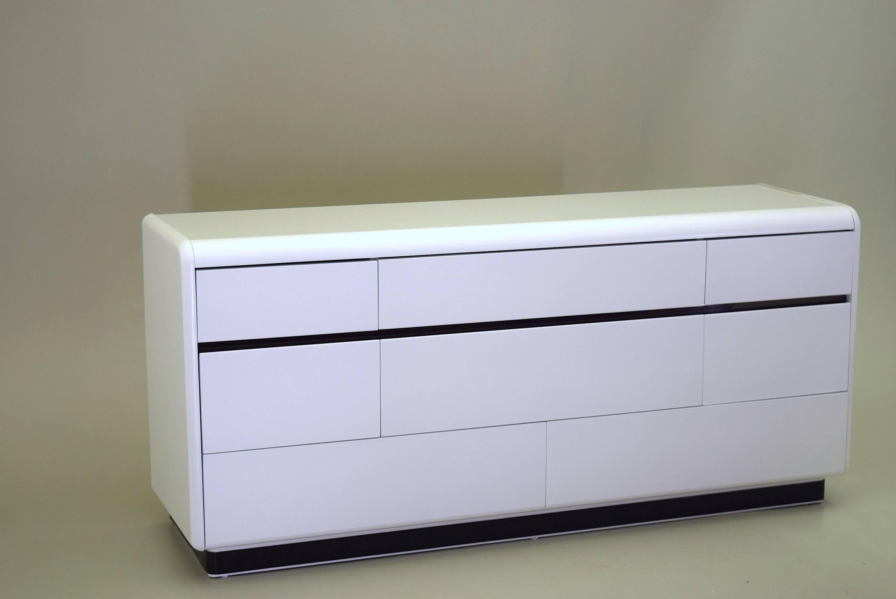 Price is for dresser and nightstand. 

A set of very difficult to find mid century designs by Lane Furniture. Produced circa 1970-1980 these modernist pieces are finished in beautiful white lacquer with the tops featuring a high gloss smooth