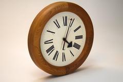 Montage of Three Vintage Wall Clocks by Howard Miller