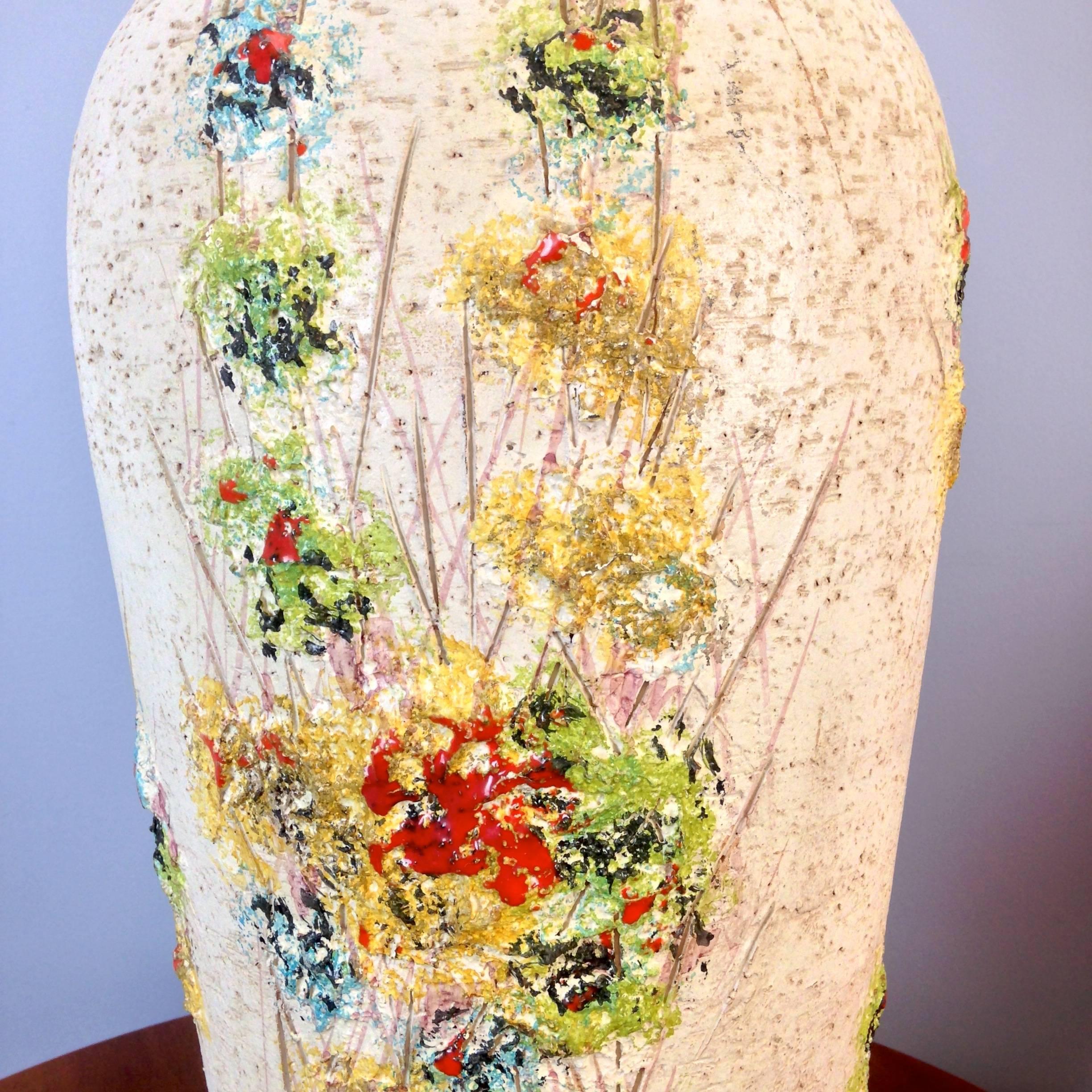 This lamp designed by Aldo Londi for Bitossi Ceramiche, Italy and imported by Raymor.  This specific design was called "Abstract Garden." 
Signed to base.

Ceramic vessel alone is approx 10" wide,
and nearly 24" in