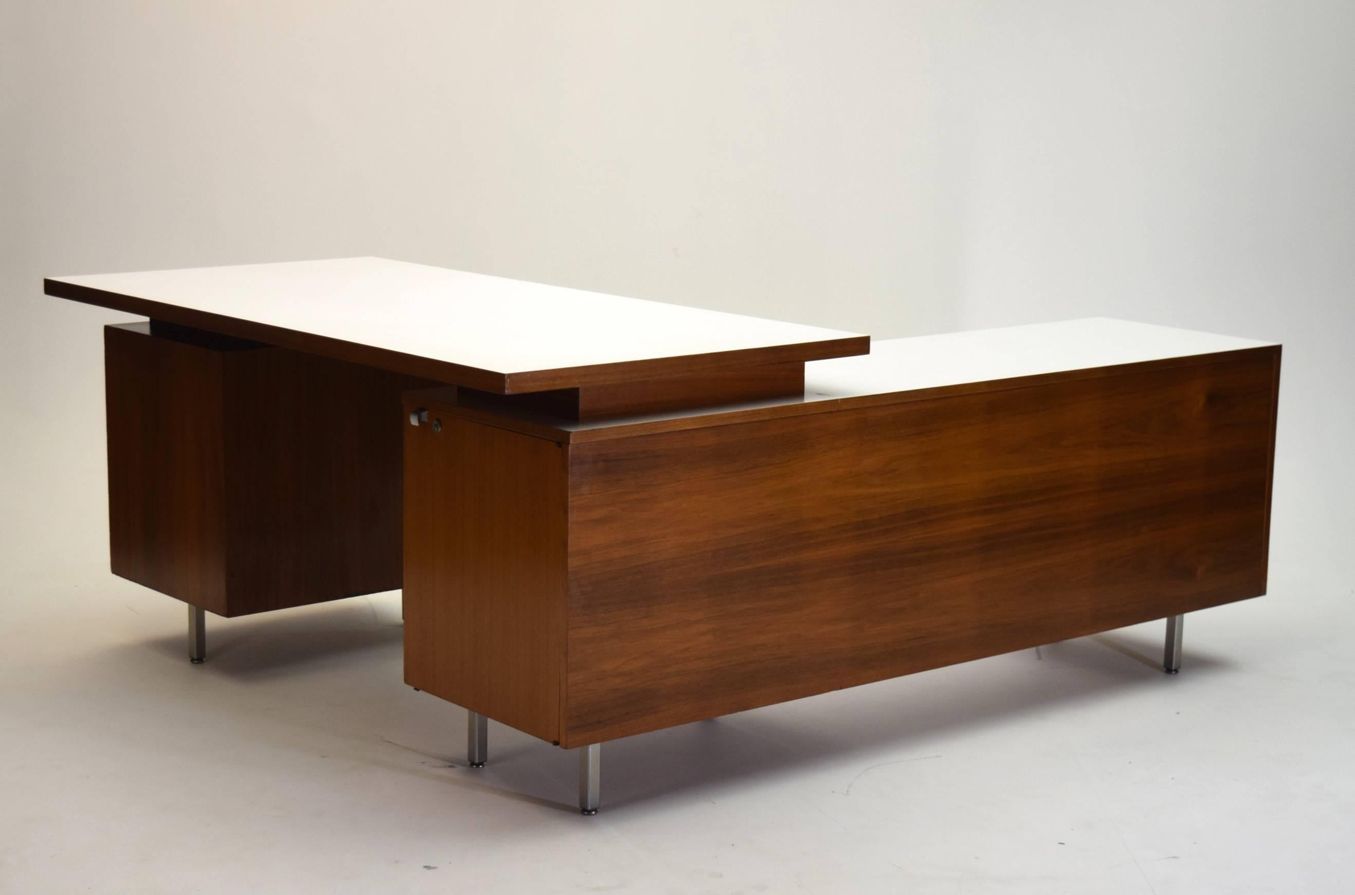 Herman Miller desk designed by George Nelson was custom ordered and produced for a bank executive circa 1960 in black American walnut and the design is featured in the 1954 issued Knoll catalog. Featuring a unique top that rather than being entirely