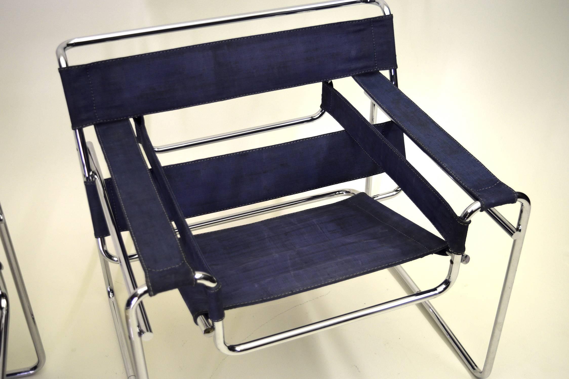 Blue canvas - not denim.

Prior to Knoll collecting the license in 1968, Gavina of Italy was the license holder for the production of the Wassily chair by Marcel Breuer.

In 1962 Gavina did a one-off limited edition of the chairs in canvas as a