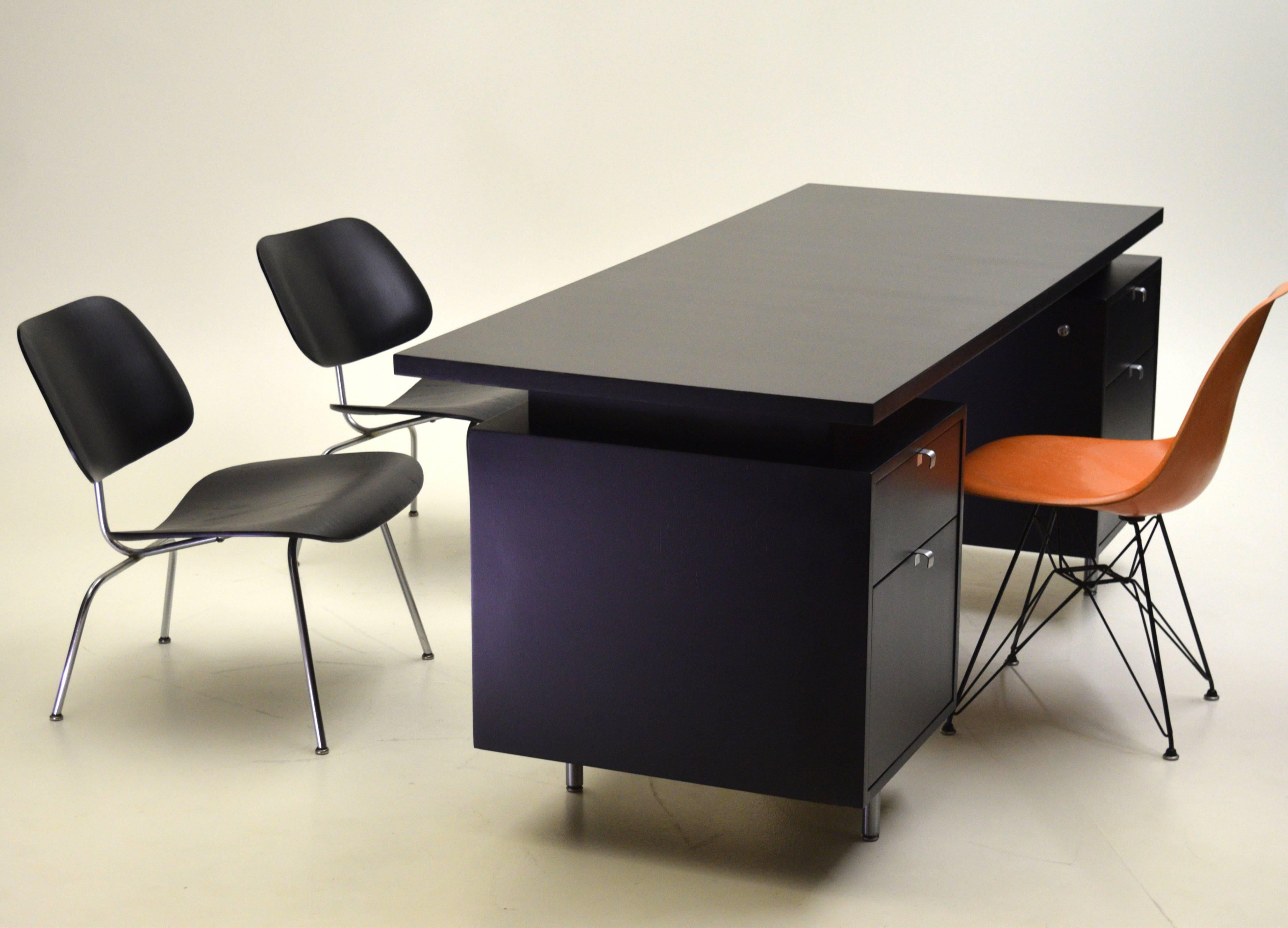 Bold and commanding, the George Nelson executive series desks combine functionality coupled with modernist lines for a timeless look.

Produced in the late 1950s-early 1960s this vintage custom ordered desk boasts two file drawers within the