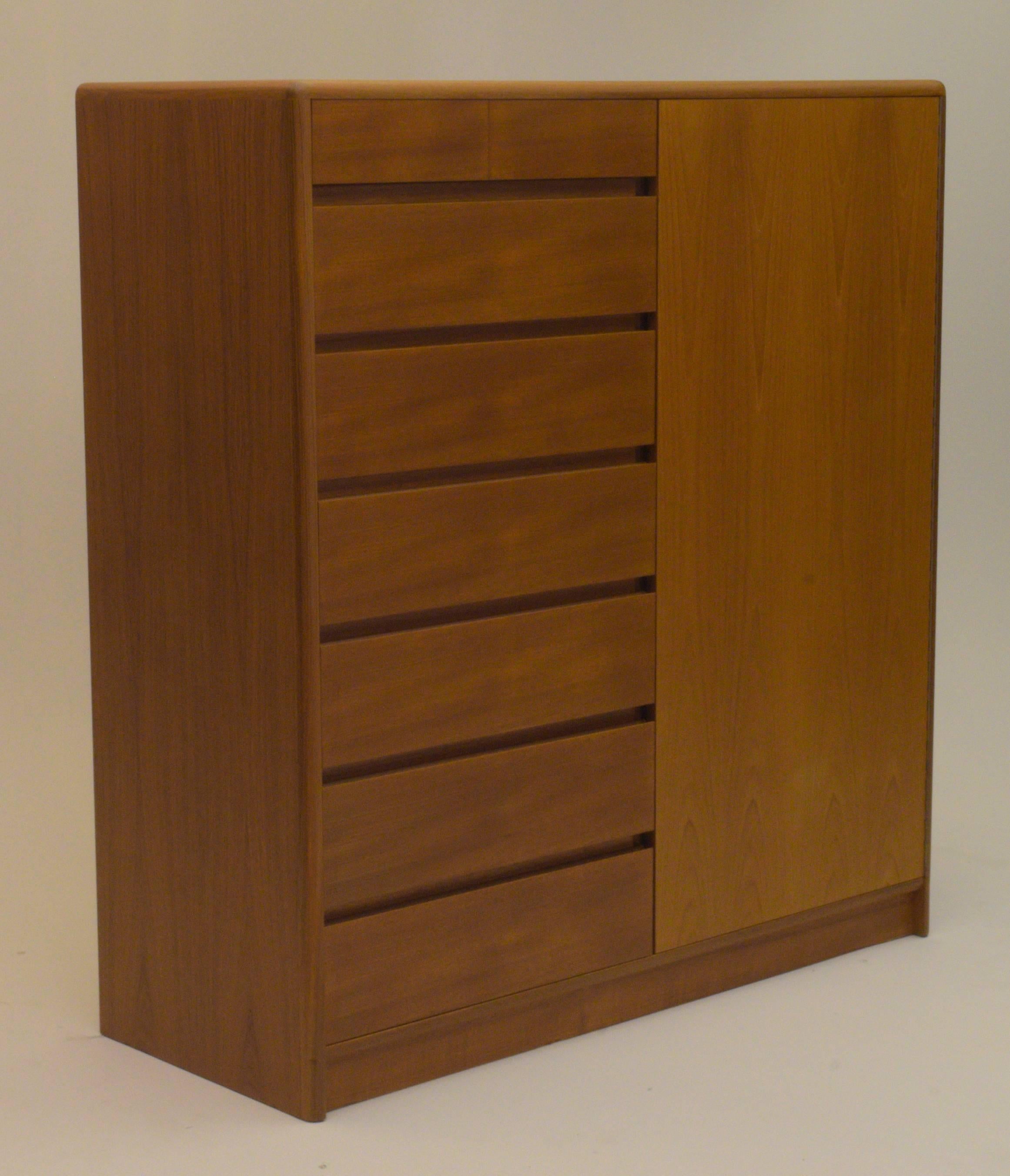 Tall modernist Danish modern design for your bedroom. Armoire. Produced in the 1960s Copenhagen, Denmark. It is exceptionally well-designed and built.

Matching low boy dresser chest available in separate listing also.

Warm teakwood and a