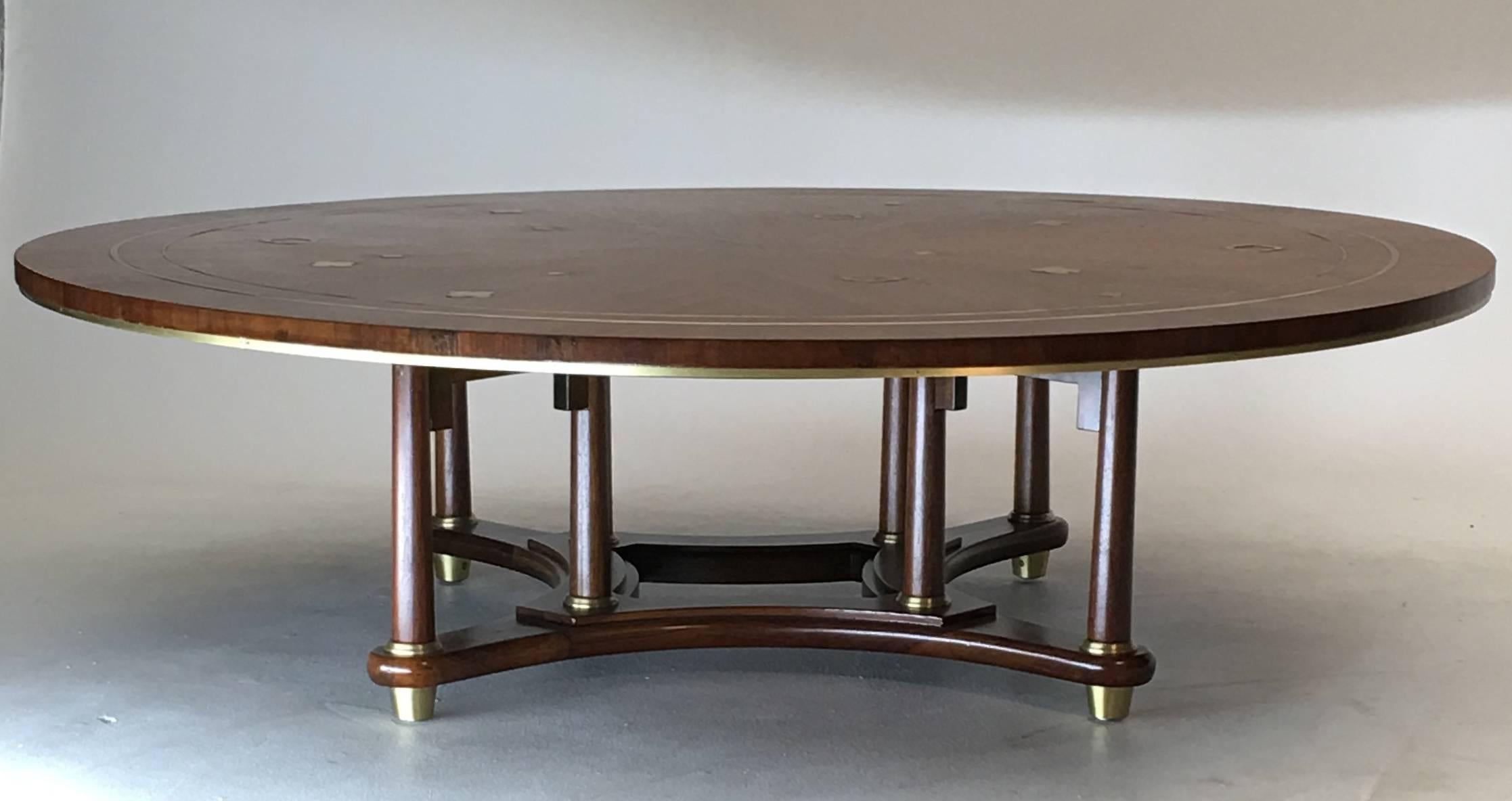 Gorgeous 5 foot coffee with inlaid brass on top surface and design accents throughout. This table was part of the 