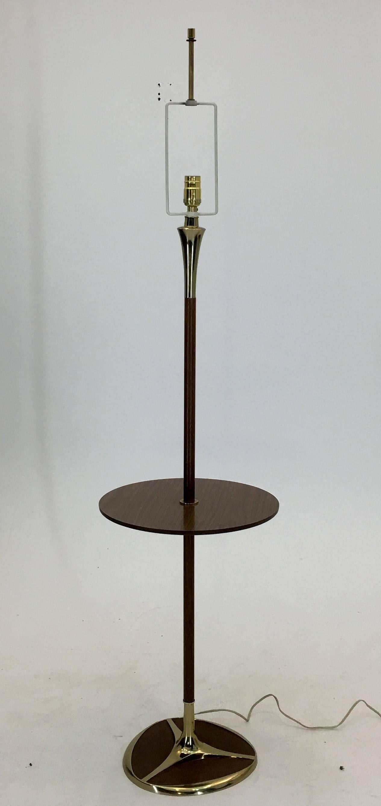 Produced circa 1965, this design from Laurel lamp company is generally attributed to Gerald Thurston who made a number of designs for the Laurel Lamp Company. Features an inlay upon a tulip styled base and is quite elegant.

This floor lamp is in