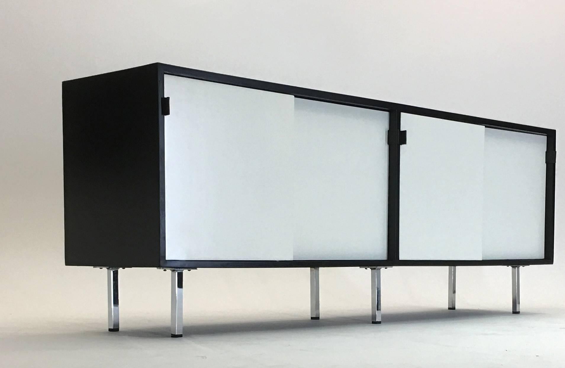 Produced by Florence Knoll at Knoll International, this credenza was made specifically for IBM and so we date it to the 1950s. We have had it restored and edited with a dynamic color block scheme to highlight the credenza and allow it to be also