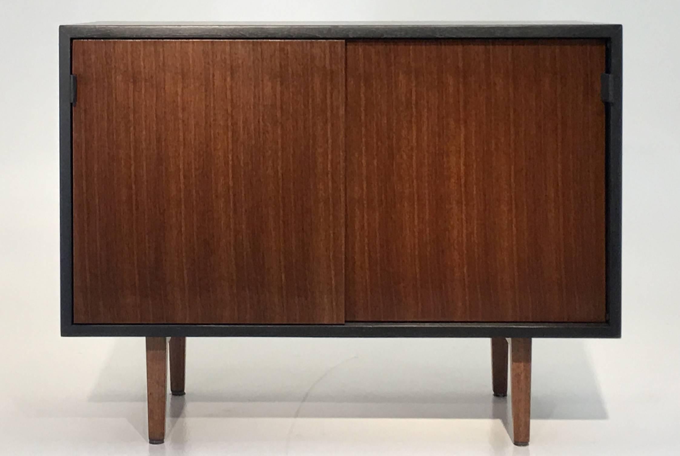 Knoll Associates, Florence Knoll
USA, circa 1952
Quartersawn walnut, lacquer, birch, leather
28 tall x 36 wide and 17.75 inches deep.

Designed by Florence Knoll and produced circa 1952, this 3 foot cabinet features the sculpted walnut wood legs