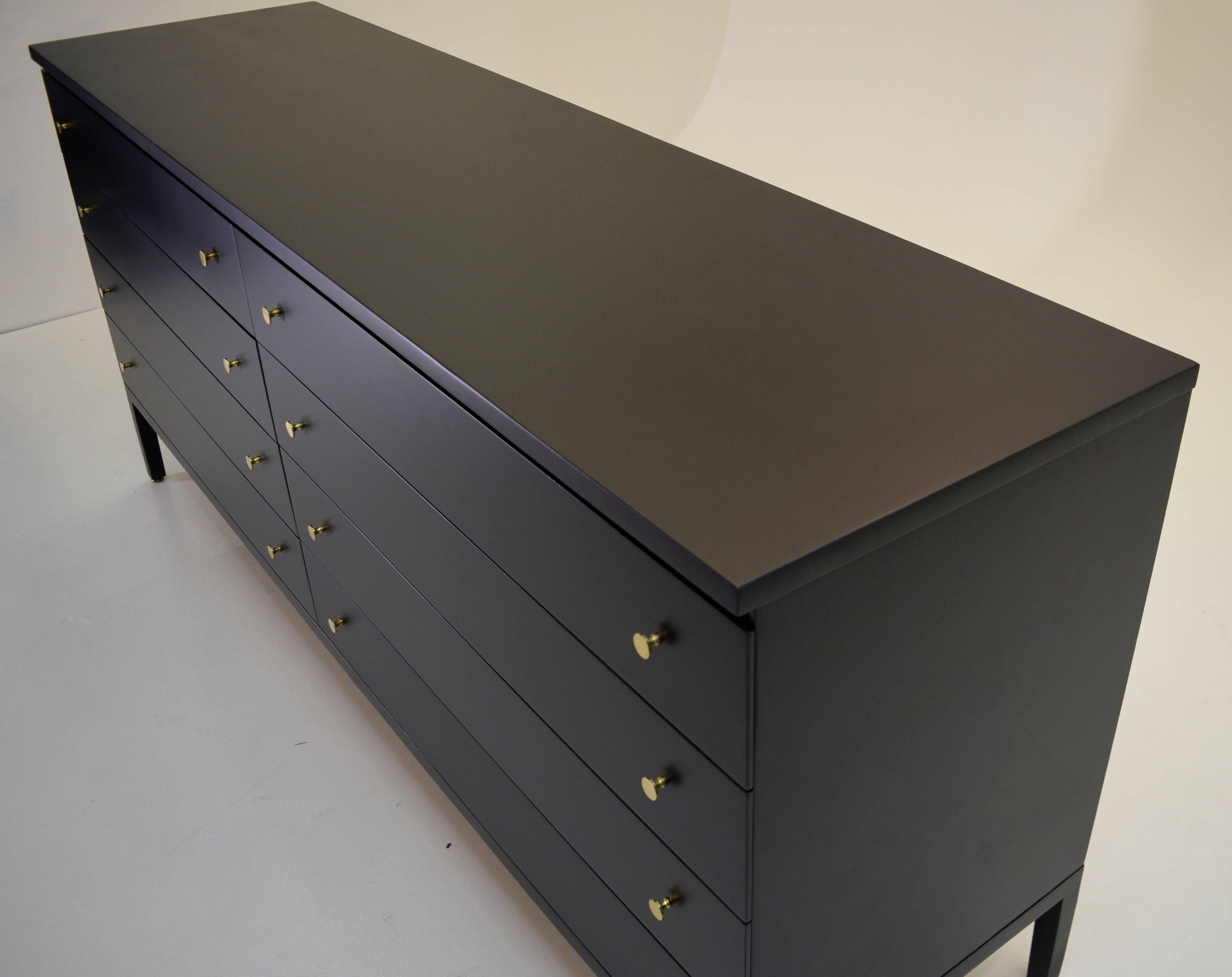 Paul McCobb, Calvin, Irwin Collection
USA, Grand Rapids, 1950s
Mahogany, black lacquer, brass
Measures: 71.25 wide 19 deep and 32.25 tall

A sophisticated and large dresser by Paul McCobb in black lacquer. In black, making a masculine and bold
