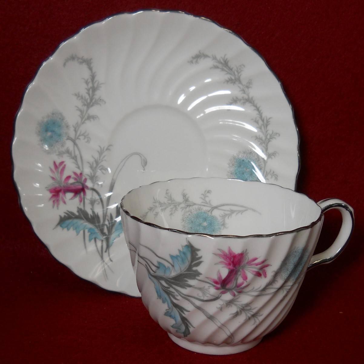 Aynsley China wayside pattern 55-piece set service for twelve (12)

in great condition free from chips, cracks, break, stain, or discoloration and with only a minimum of use.

Pattern 8183. 

Pink and turquoise flowers.

Swirled