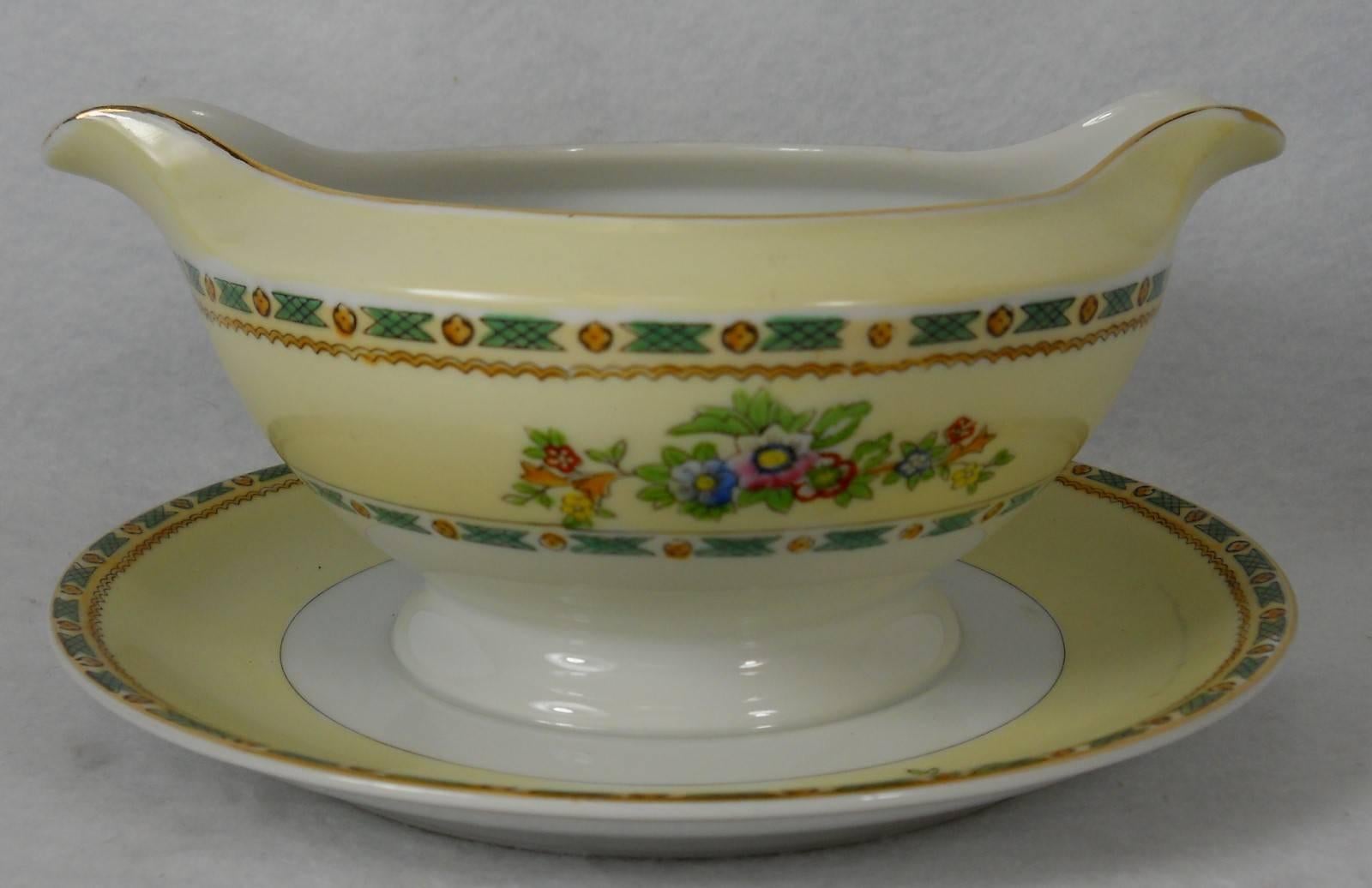 Noritake China N1327 pattern 8-piece hostess serving set.

In great condition free from chips, cracks, breaks, stains, or discoloration and with only a minimum of use.

Includes creamer, sugar bowl with lid, oval vegetable serving bowl, round