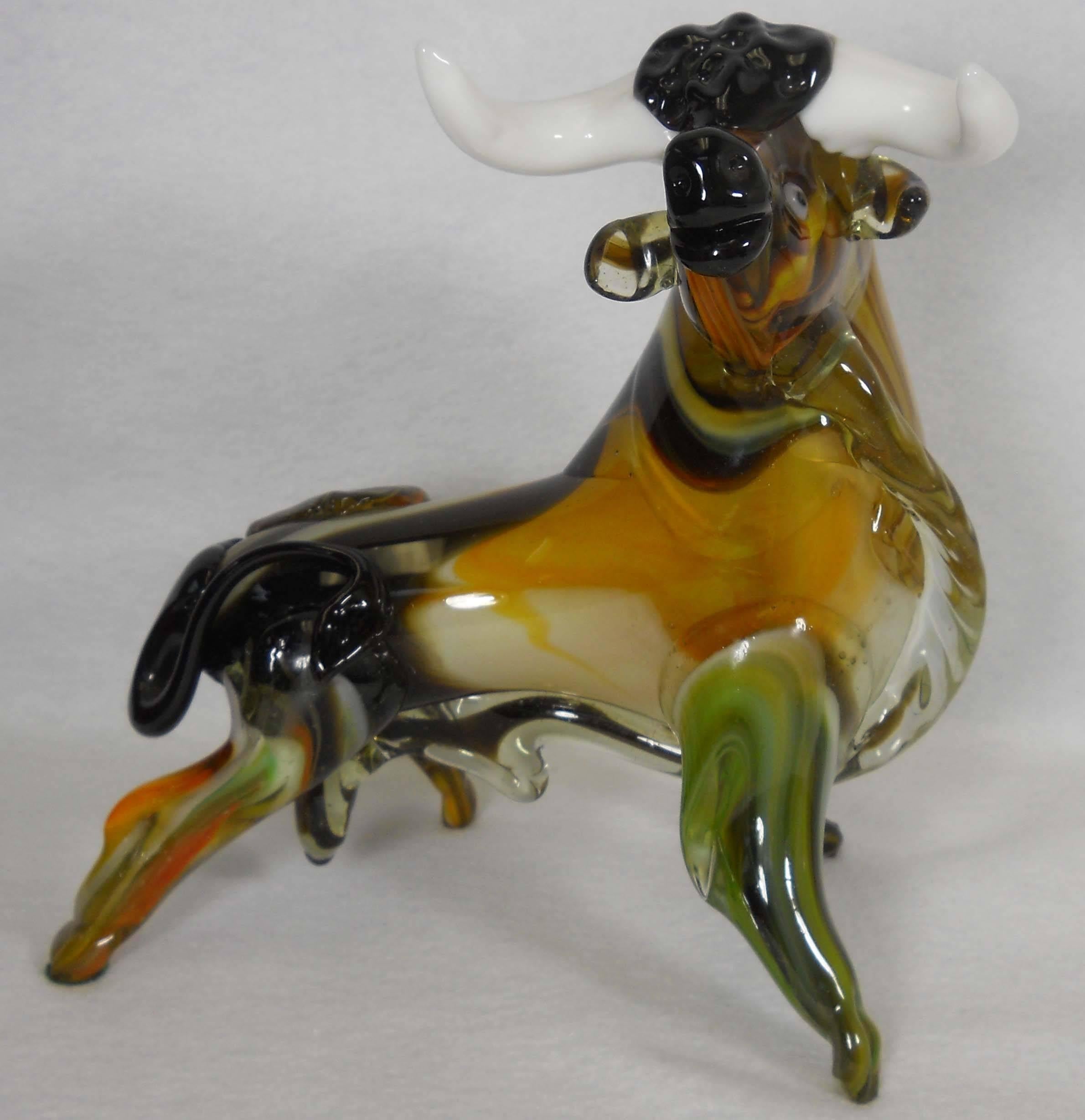 Beautiful MURANO art glass BULL. This piece was handmade in Murano Italy in the 1960’s, however, the wonderful couple who treasured him since his “birth” cannot remember which studio they bought him from. He measures nearly 9” inches tall and 9”