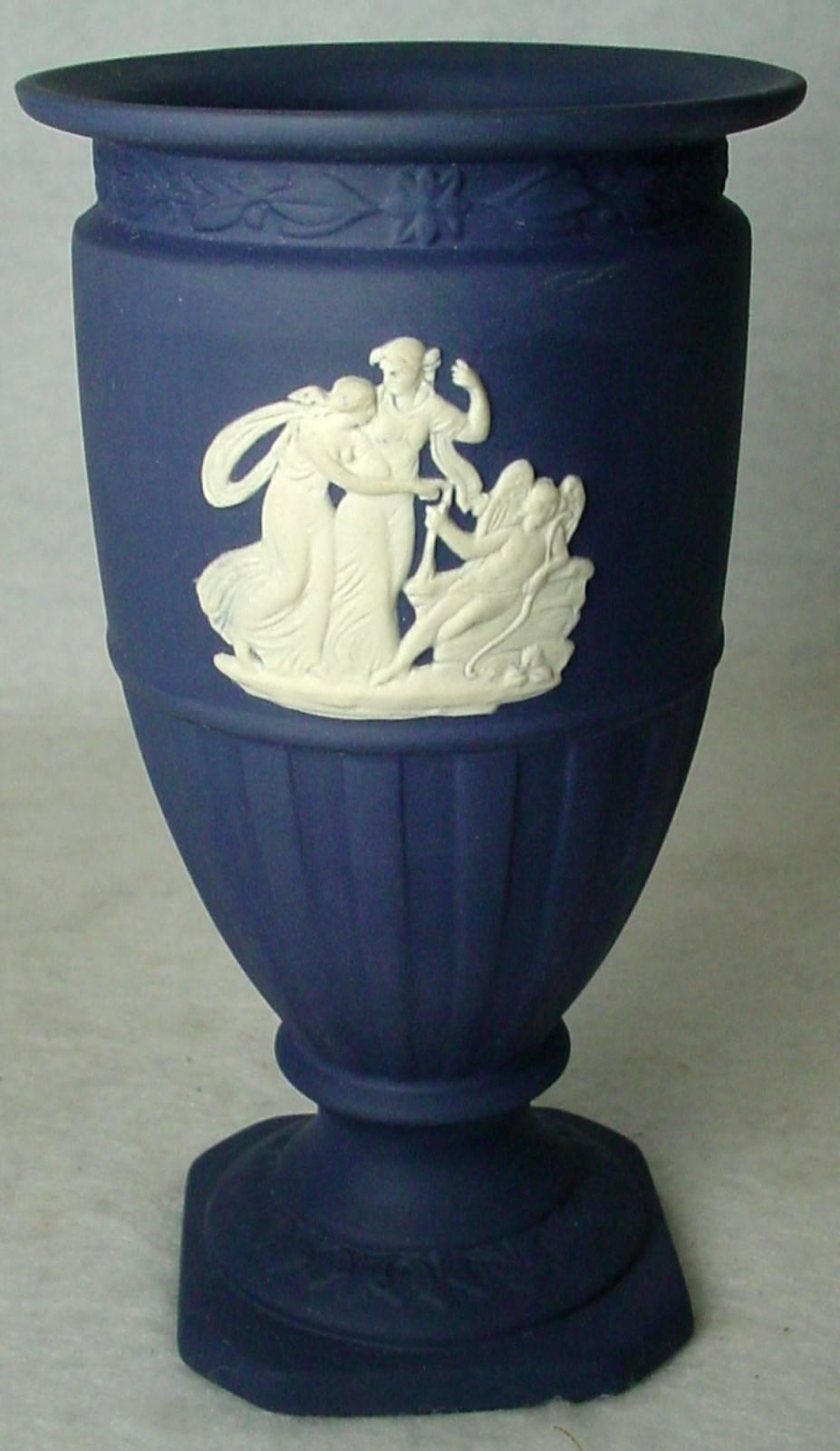  Offered here is a very lovely Wedgwood Midnight blue Jasperware 'Goddesses pattern' footed vase in excellent condition!
Midnight blue with beautiful white and blue designs. Measures about 5