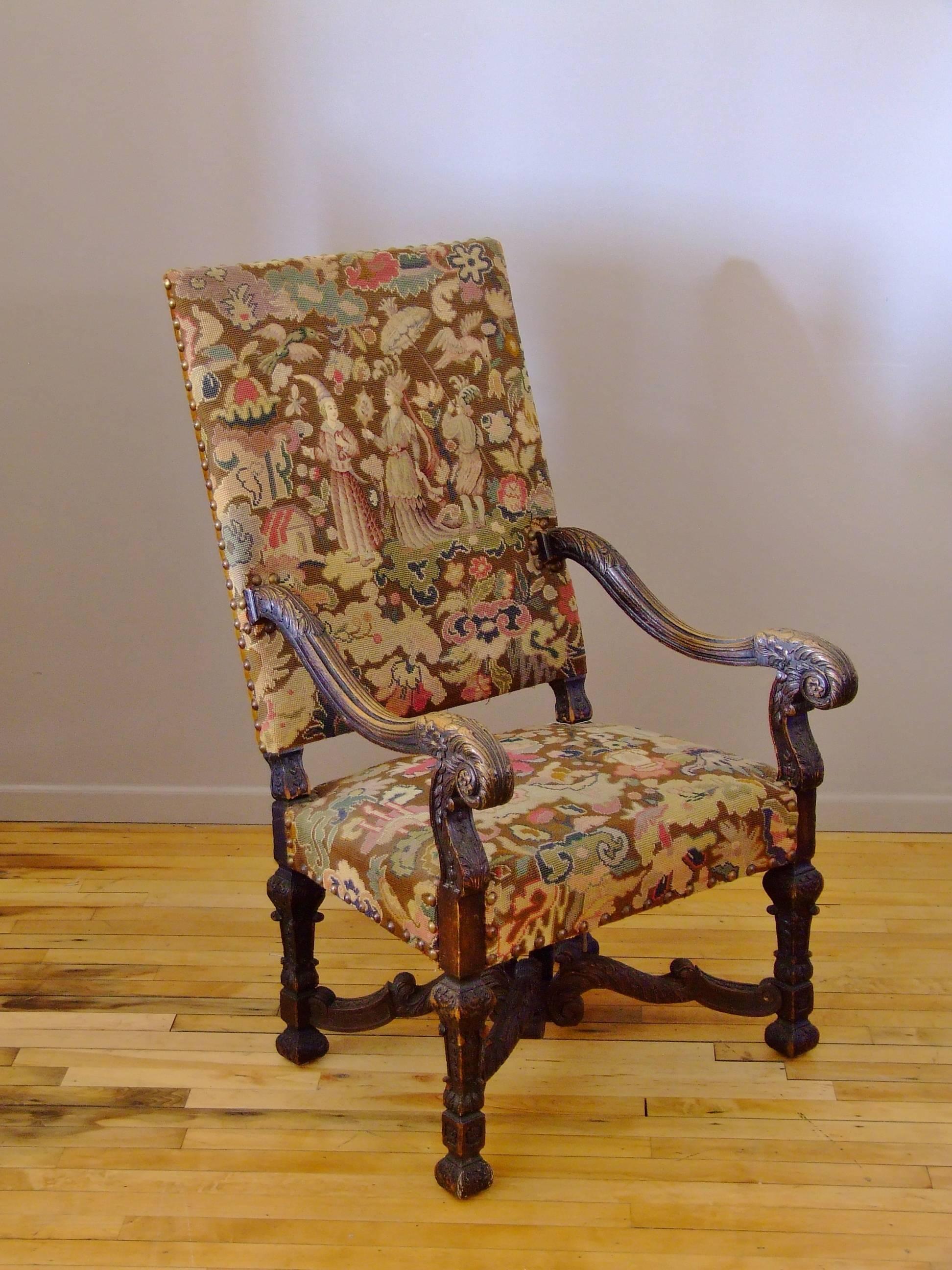 Outstanding French needlepoint chair with original needlepoint upholstery. The details on the petitpoint are the work of a very accomplished needlework artist. It is still in very good condition and the color is very strong. The needlepoint was