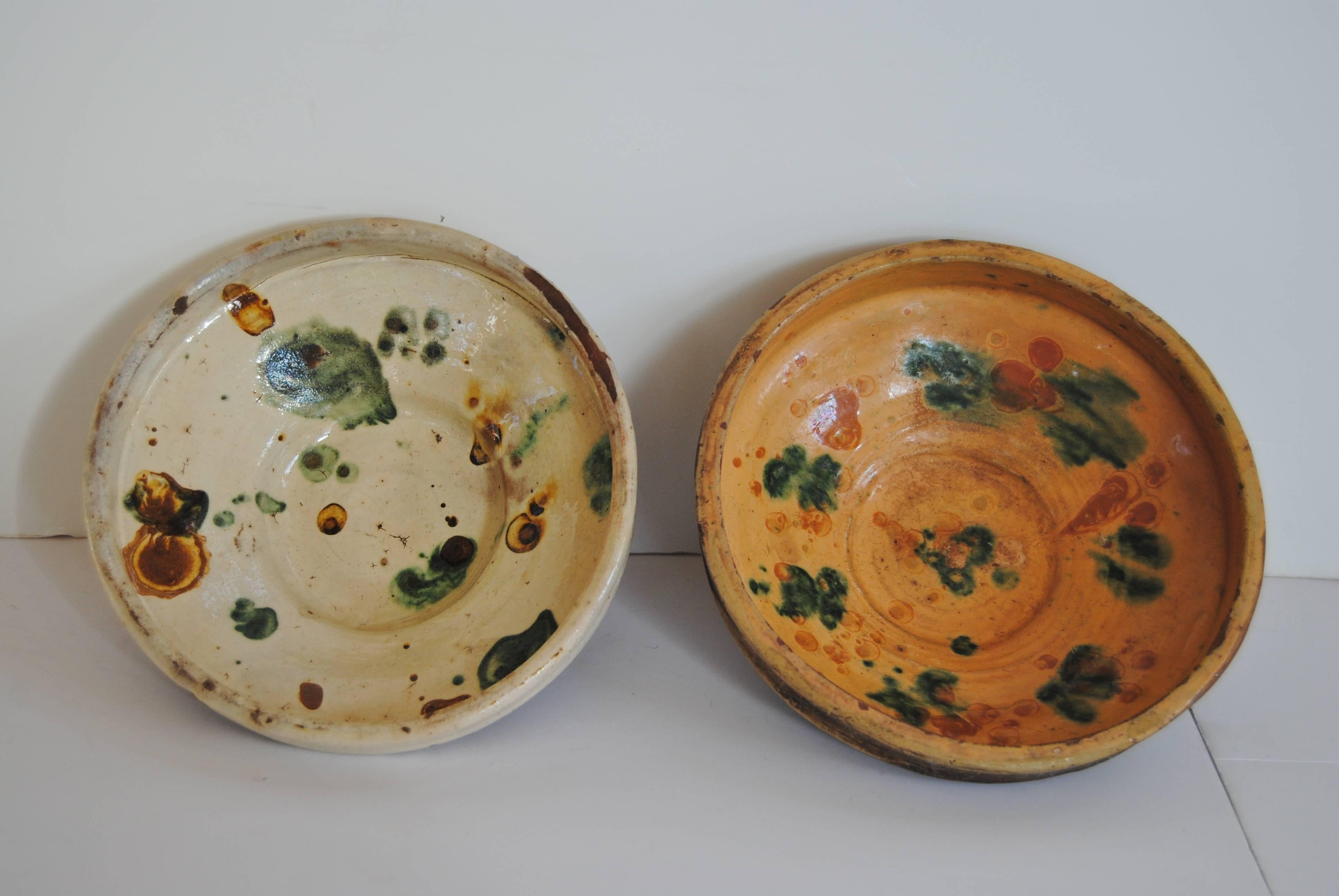 Vintage Romanian pottery bowls from Transylvania. Earthenware colors still vivid. Wonderful folk art for display.