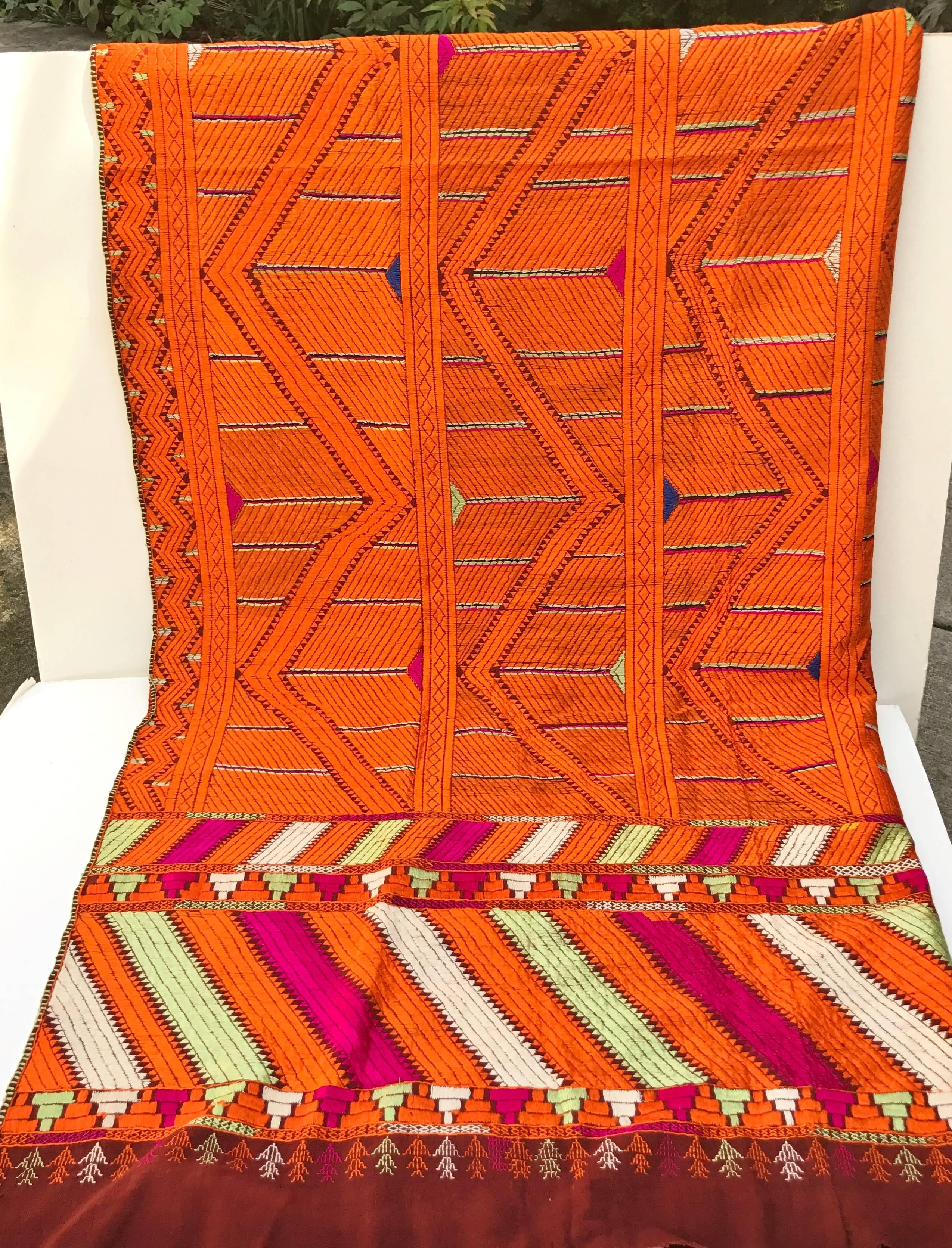 Vintage phulkari bagh wedding shawl from Punjab, India. The cotton hand loomed khadi cloth is hand embroidered with silk threads by members of the young girl's family for her wedding. Shawl is in very good condition. Family heirloom, one of a kind,