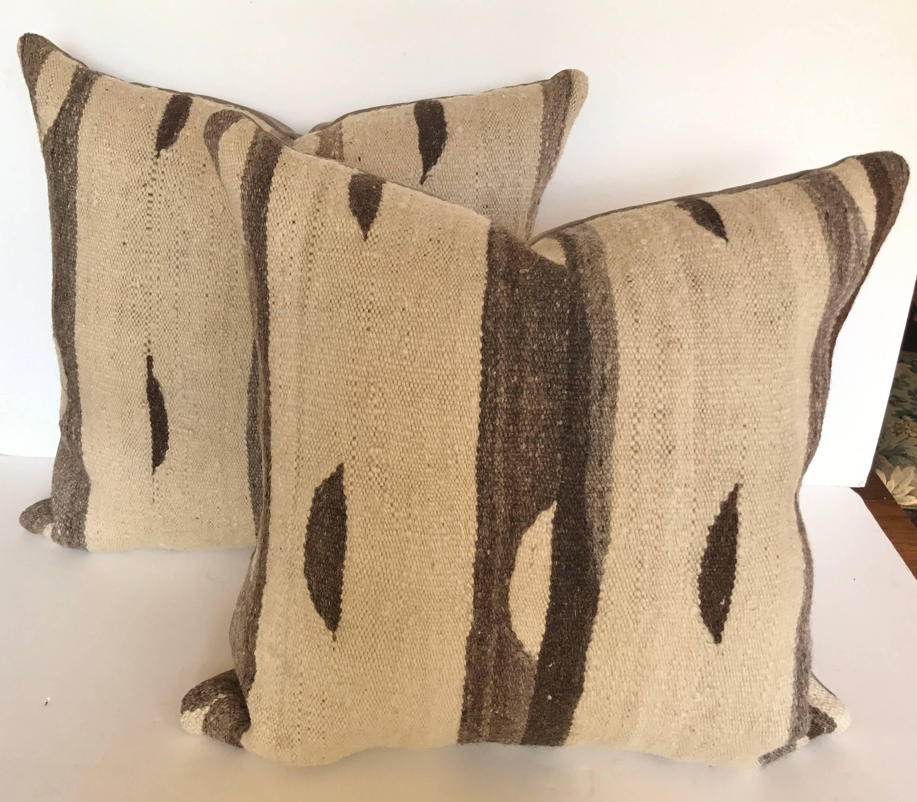 Custom pillows cut from a vintage Moroccan hand loomed wool Ourika kilim from the High Atlas Mountains. Wool is soft and lustrous, made in the Ourika Valley with all natural color. The kilim contains natural slubs due to the nature of the weaving.