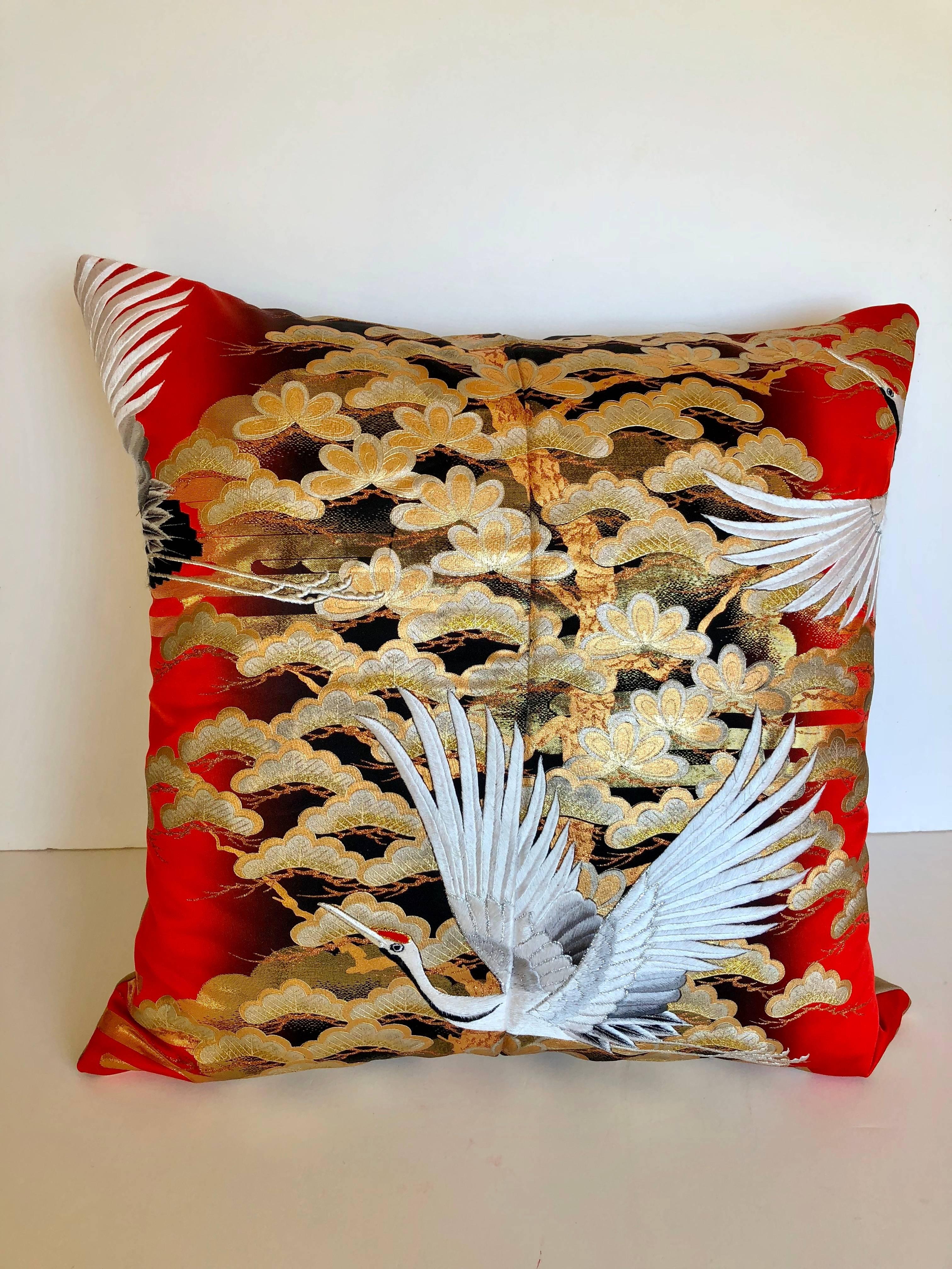 Custom pillow cut from a vintage Japanese silk Uchikake, the traditional wedding kimono. The silk is embellished with hand-painted designs and embroidered birds. The pillow is backed in a wool/silk textile, filled with an insert of 50/50 down and