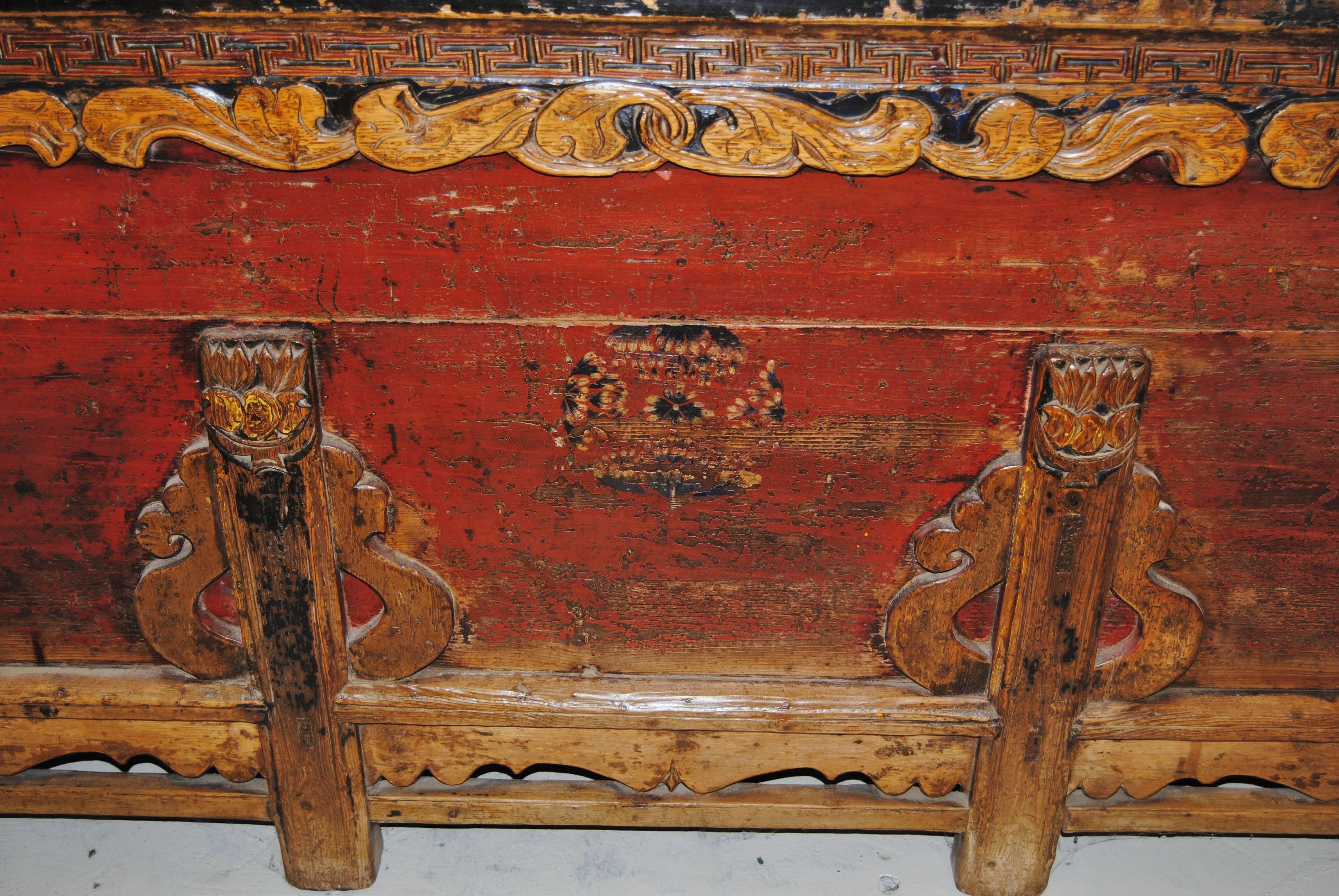 This antique Chinese cabinet from Quinghai province has three compartments and was originally used to store grain. Doors were typically cut in the fronts of cabinets for the recent import market, so it is rare to find one in its original condition.